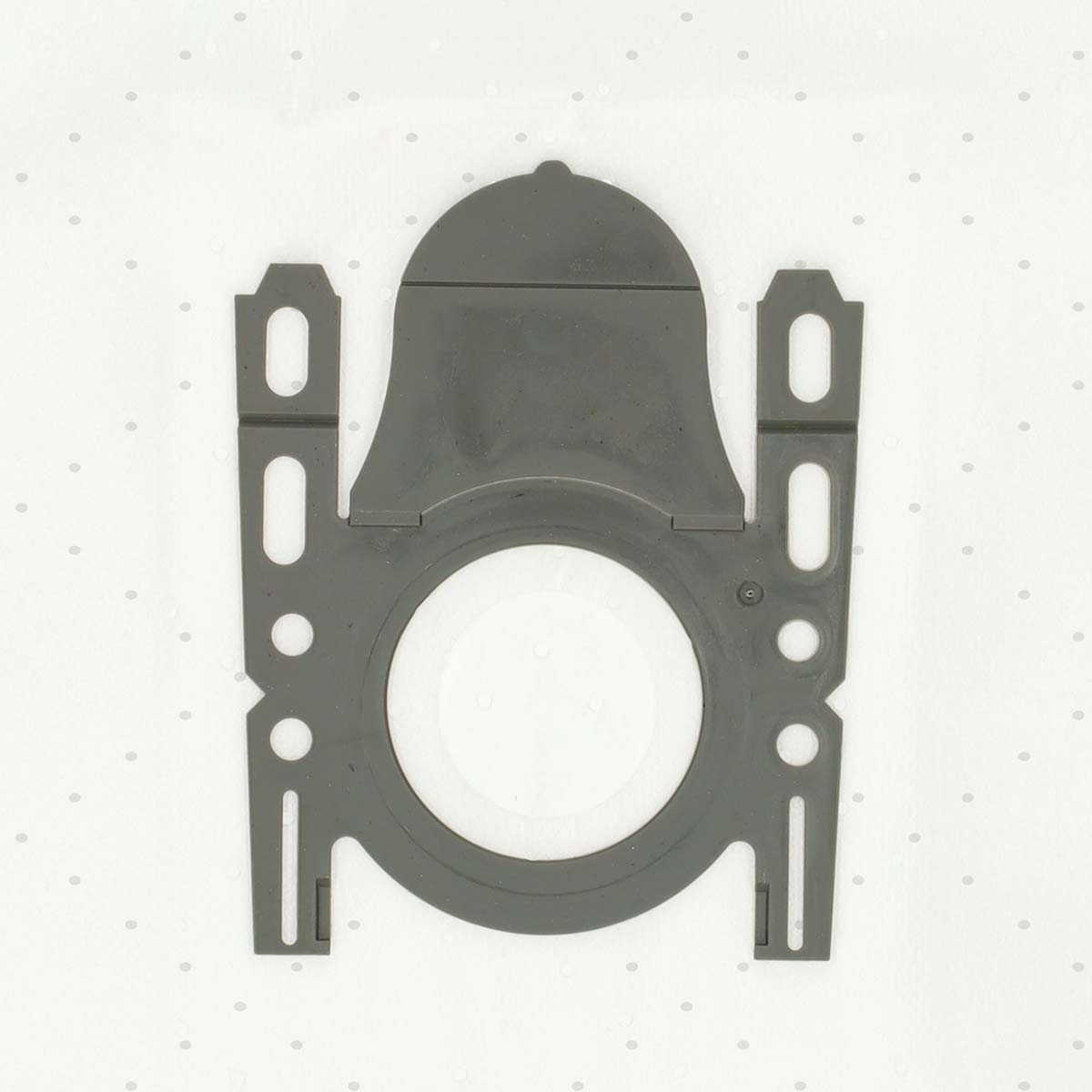A gray plastic vacuum cleaner bag adapter. It has a central circular opening, with two side brackets and a top dome-shaped piece.