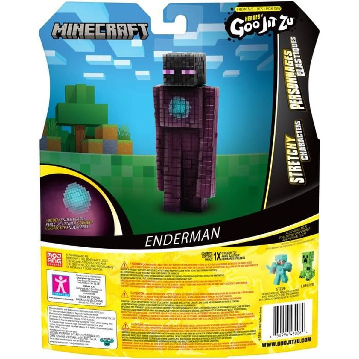 Minecraft Enderman Spielzeug in Verpackung. Lila Figur mit schwarzem Kopf. Grüner pixeliger Hintergrund.