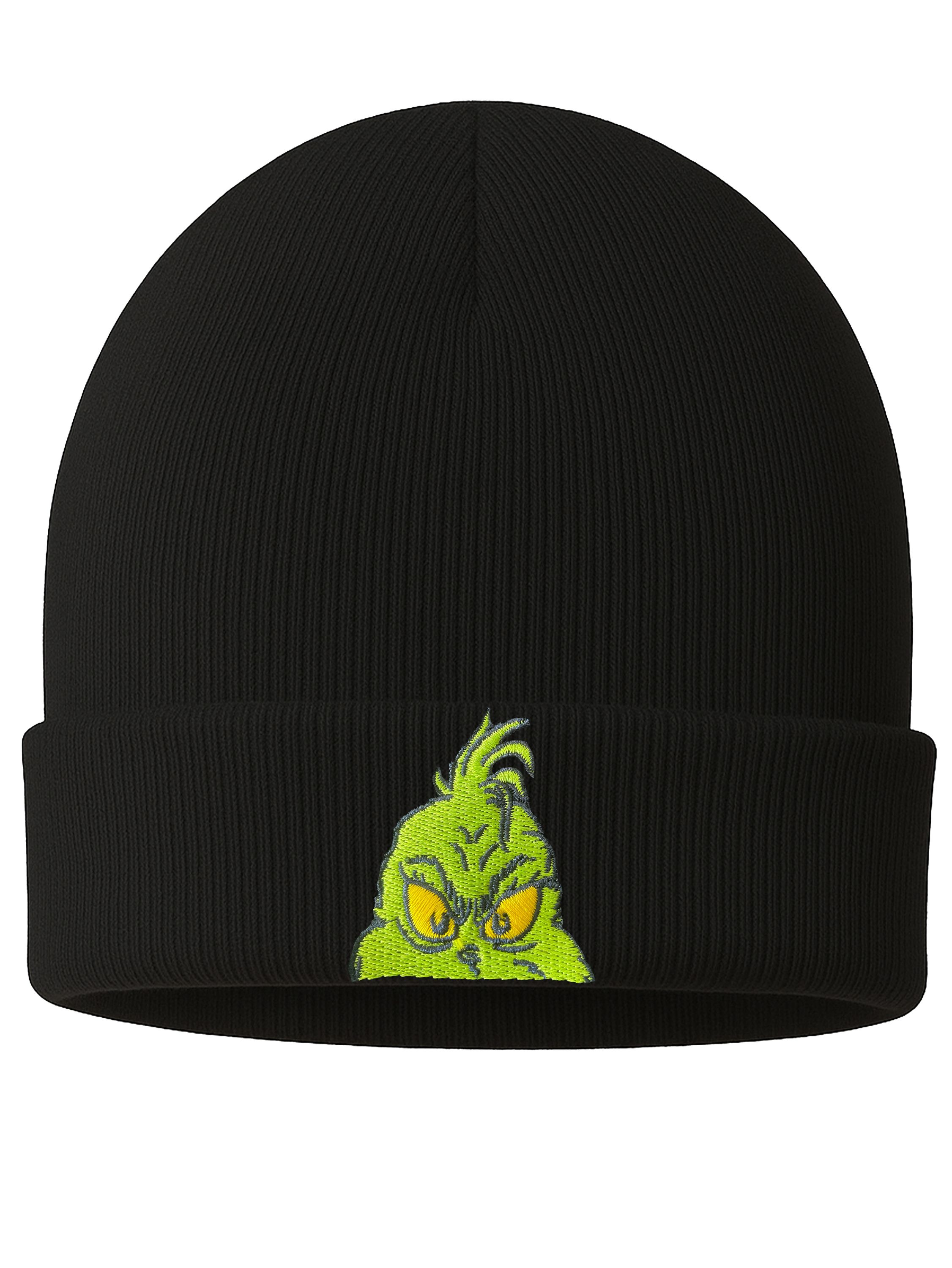 Eine schwarze Beanie-Mütze mit einem gestickten Grinch-Gesicht. Der Grinch hat gelbe Augen und ist grün.
