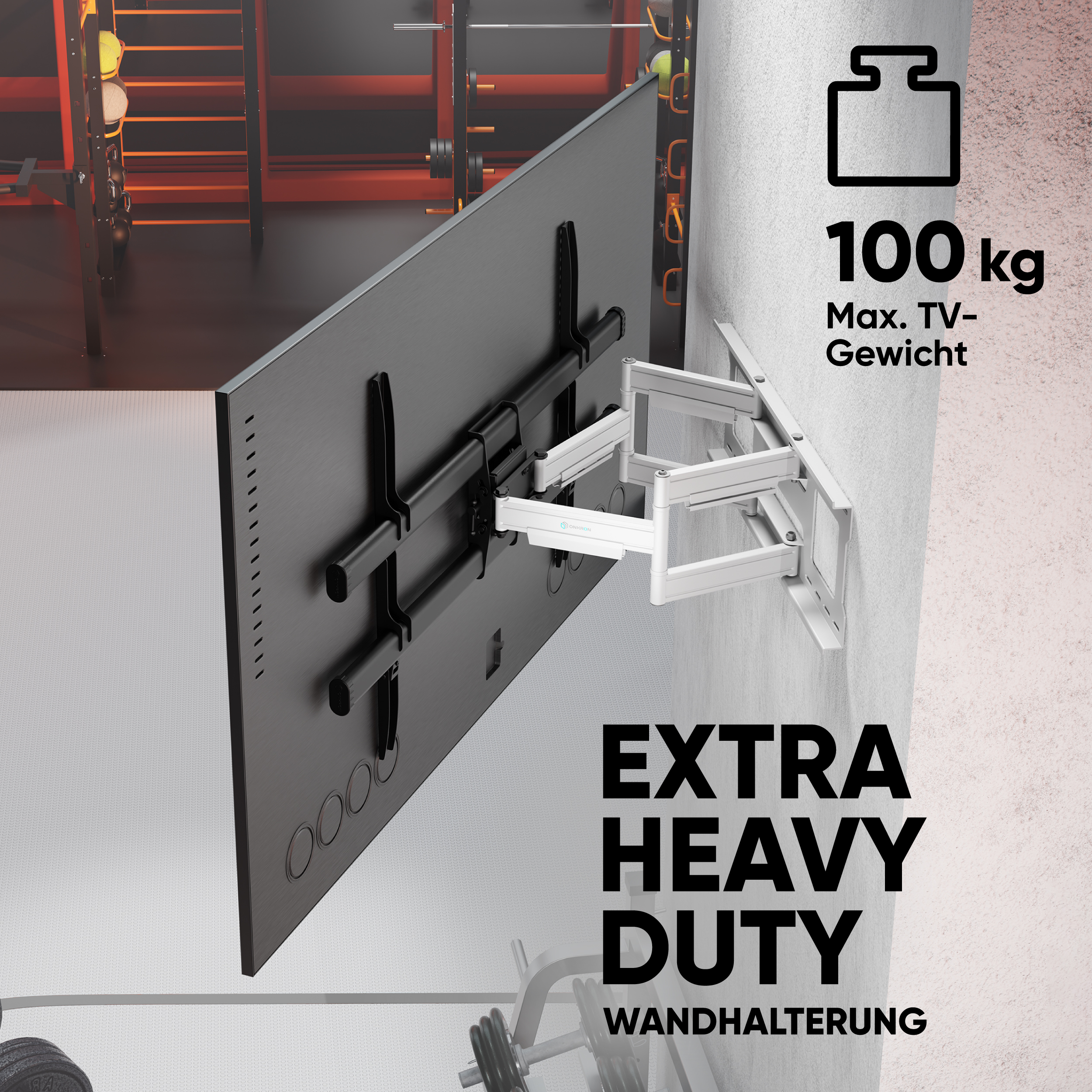 TV-Halterung an der Wand. Text: Extra Heavy Duty, 100 kg max Gewicht. Fitnessstudio im Hintergrund.