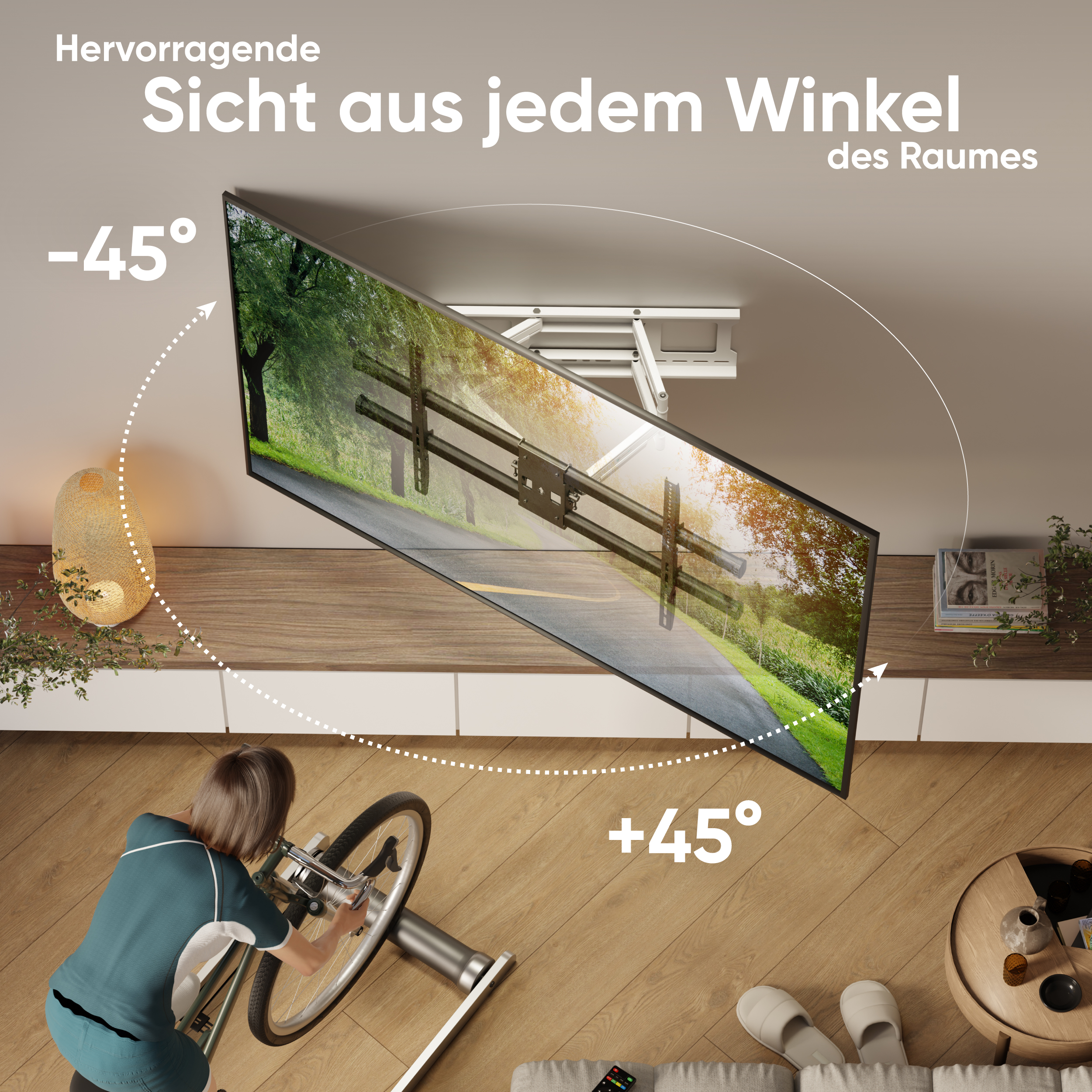 Ein Fernseher ist an der Decke montiert. Eine Person fährt Fahrrad auf einem stationären Fahrrad. Der Raum ist modern.