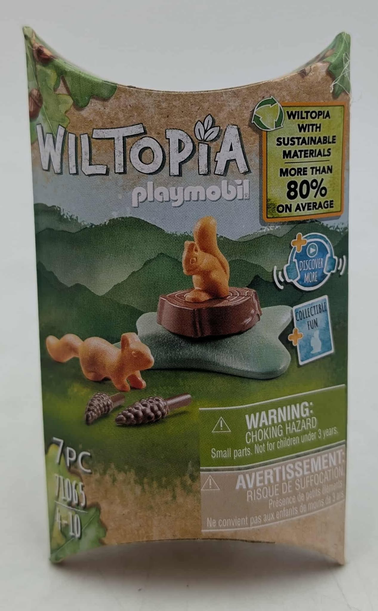 Boxed toy set with 'WILTOPIA' logo. It features squirrel figurines, a tree trunk, and warnings about small parts.