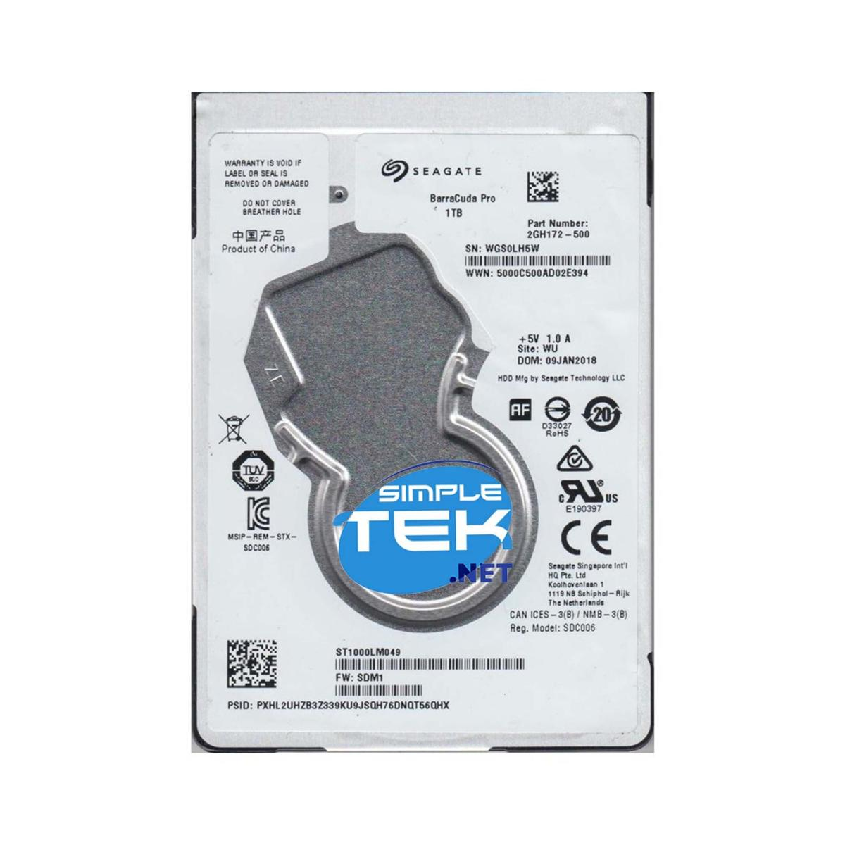 Un disco rigido Seagate Barracuda Pro da 1TB. Le etichette contengono informazioni sul prodotto e avvertenze.