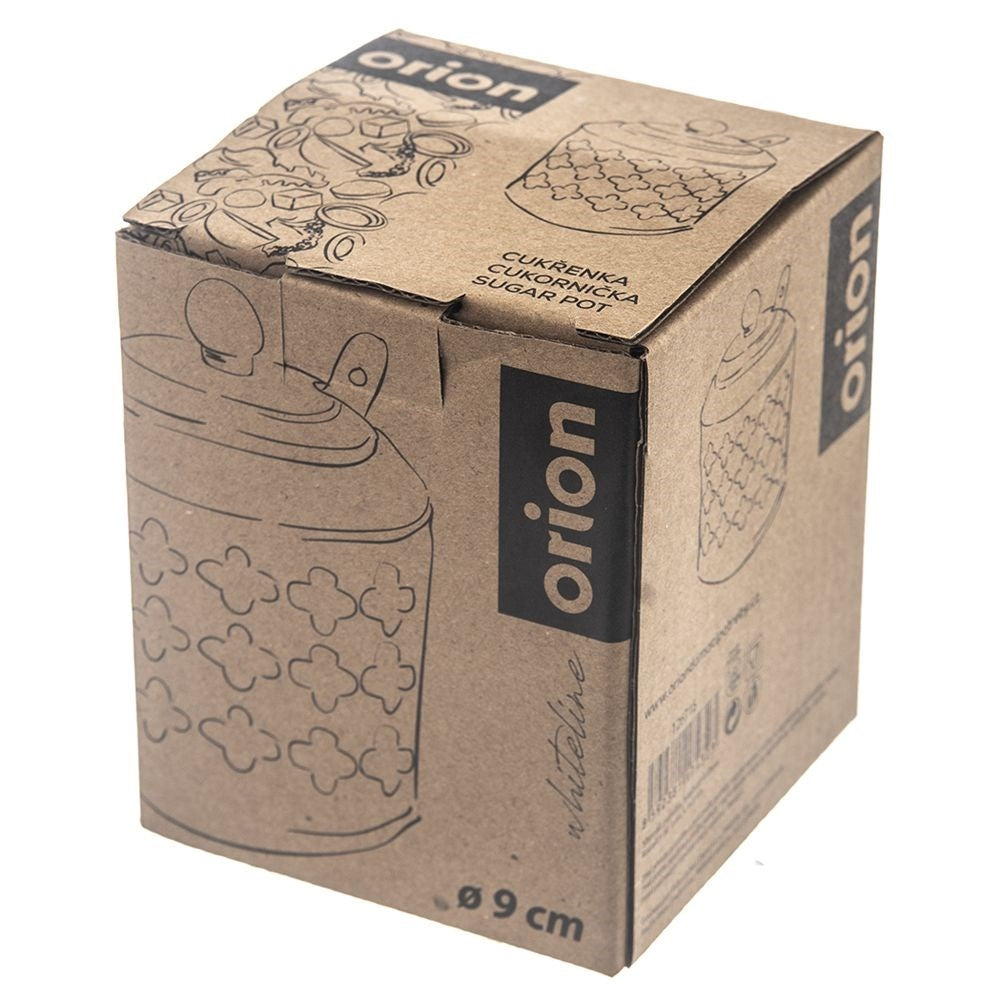 Una scatola di cartone con l'etichetta 'orion' contiene un zuccheriera con disegni floreali. La scatola presenta disegni e testo in più lingue.