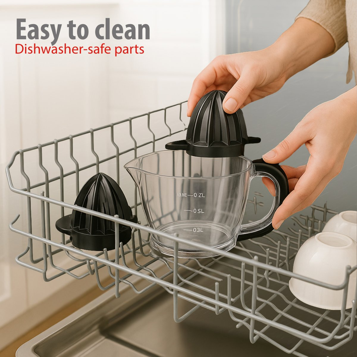 Hands placing a black juicer into a dishwasher rack with a clear measuring cup and small white bowls.