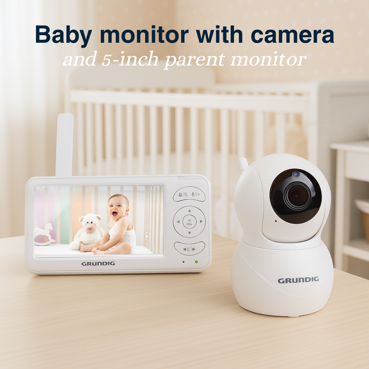 A white baby monitor set with a screen showing a baby in a crib. A camera is on the right. The brand is Grundig.