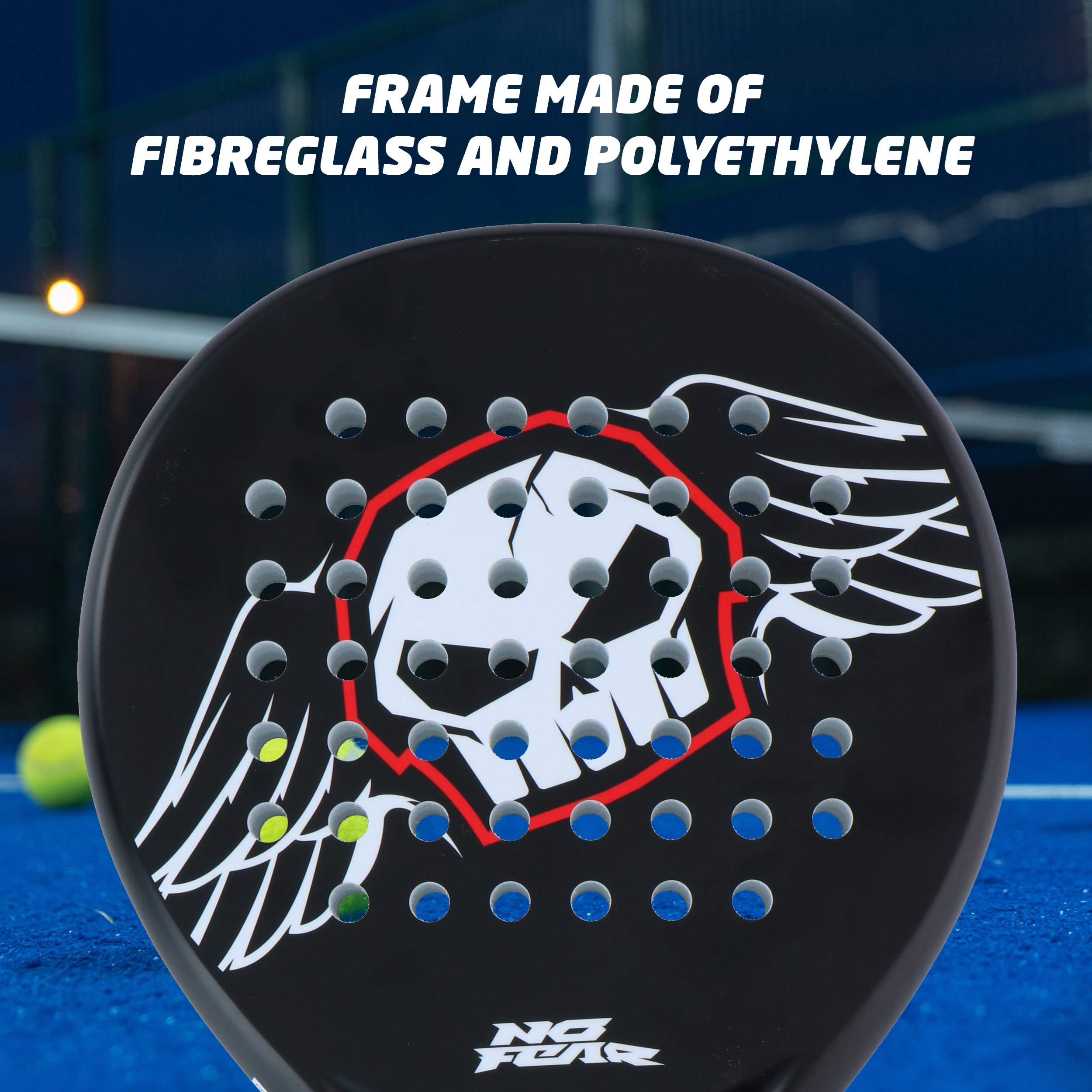 Black paddle with skull design and holes, text 'FRAME MADE OF FIBREGLASS AND POLYETHYLENE'. Yellow tennis ball.