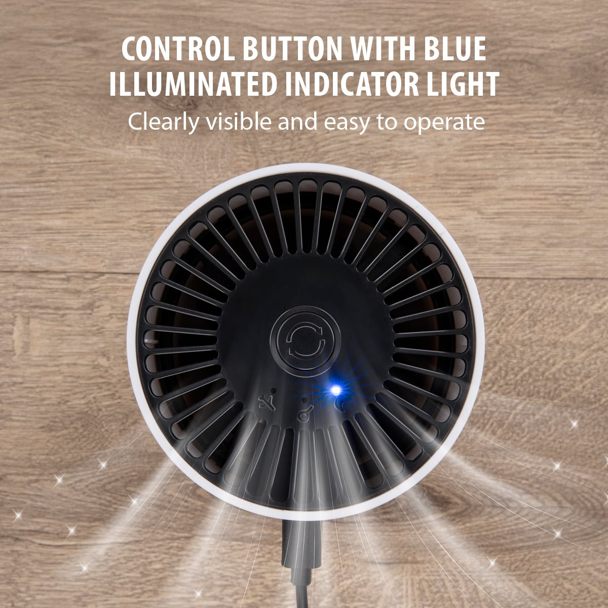 Ein schwarz-weißer, kreisförmiger Luftreiniger mit blauem Kontrolllicht. Er steht auf einer Holzoberfläche. Der Text lautet 'Control button'.