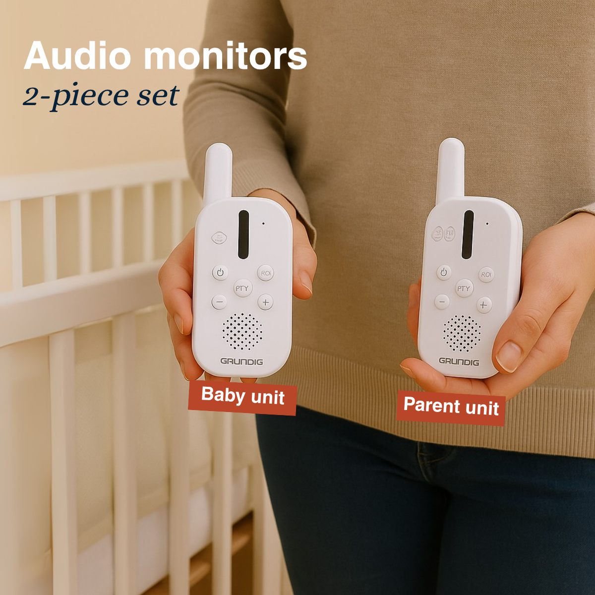 A person holding two white baby monitors. One labeled 'Baby unit,' the other 'Parent unit'. A crib is visible in the background.
