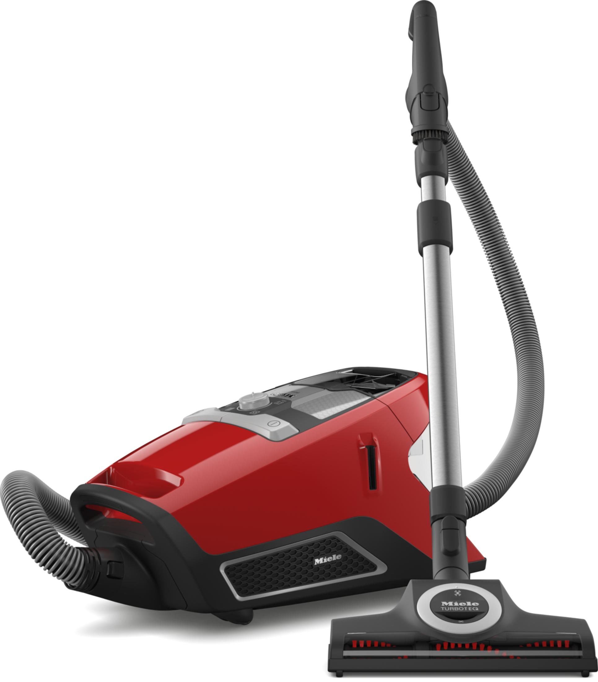 Un aspirapolvere Miele rosso con manico e tubo neri. La testina dell'aspirapolvere è a terra.