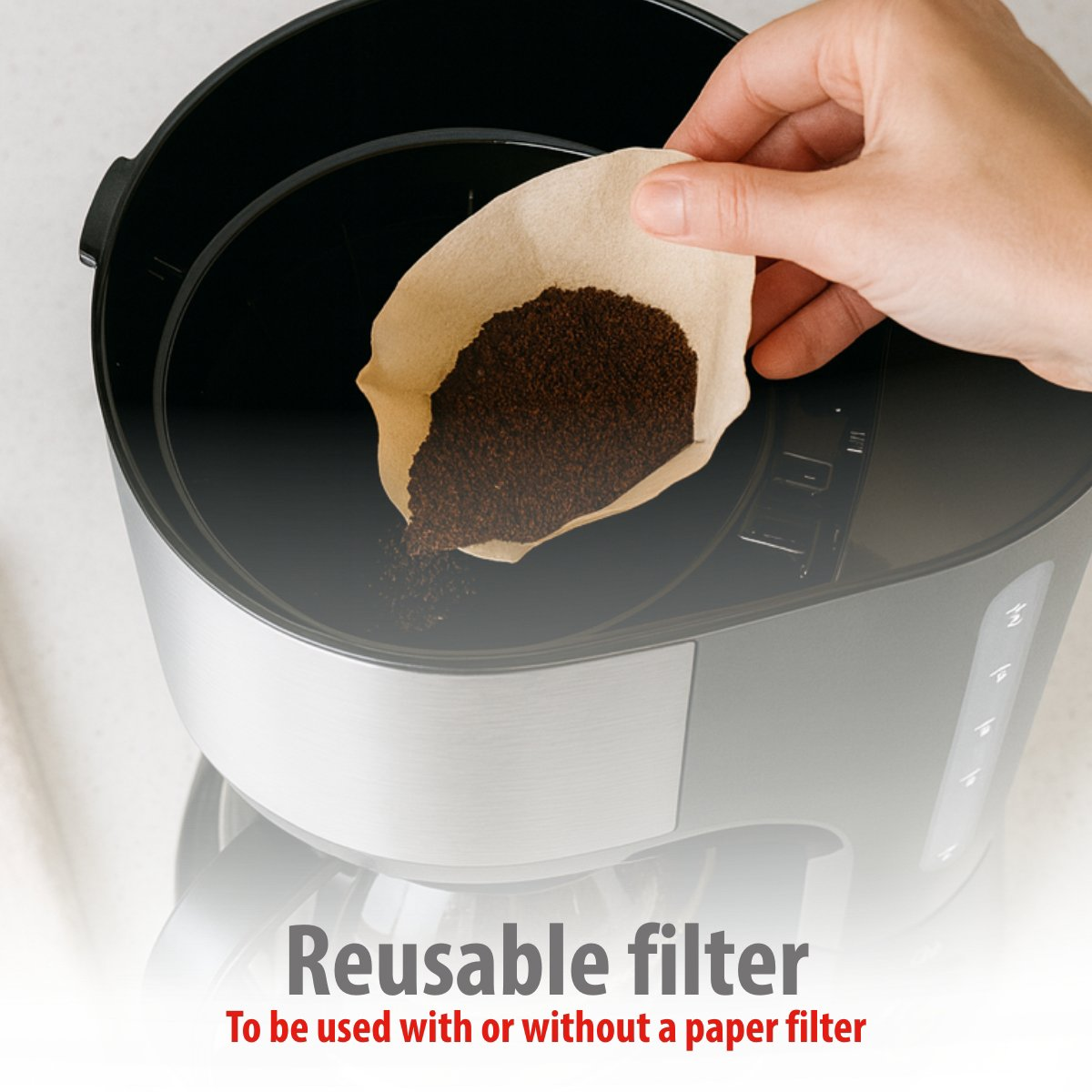 A hand holding a paper coffee filter filled with ground coffee, above a coffee maker. The text at the bottom reads: Reusable filter.