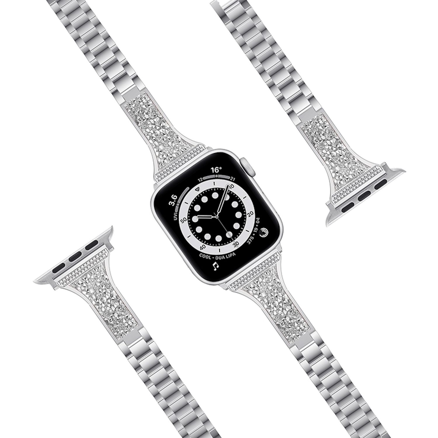 Eine Apple Watch mit silbernem Armband, verziert mit Strasssteinen. Das Zifferblatt ist schwarz mit weißen Markierungen. Das Armband ist dreiteilig.