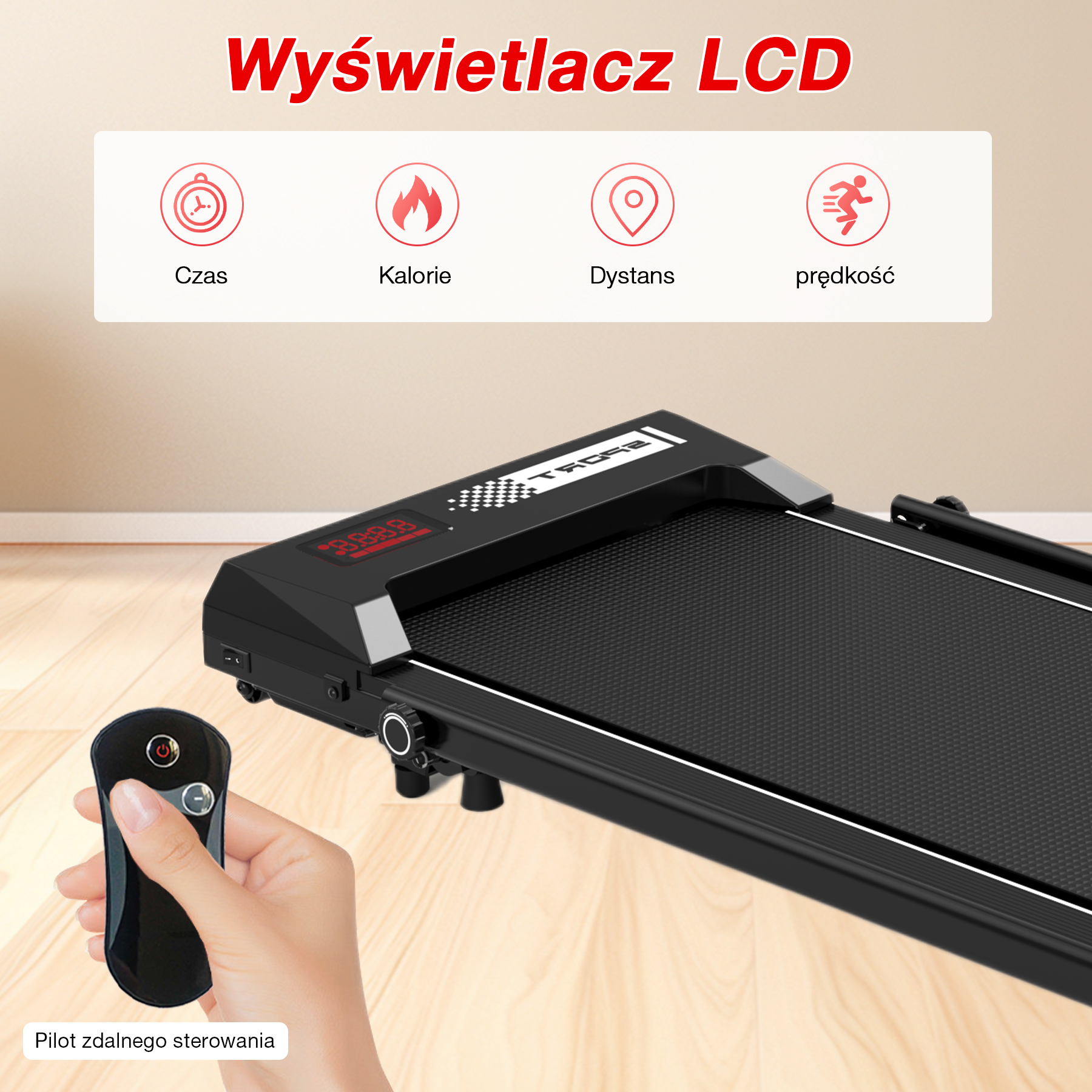 Bieżnia z pilotem. Wyświetlacz pokazuje czas, kalorie, dystans i prędkość. Ręka trzyma pilota.