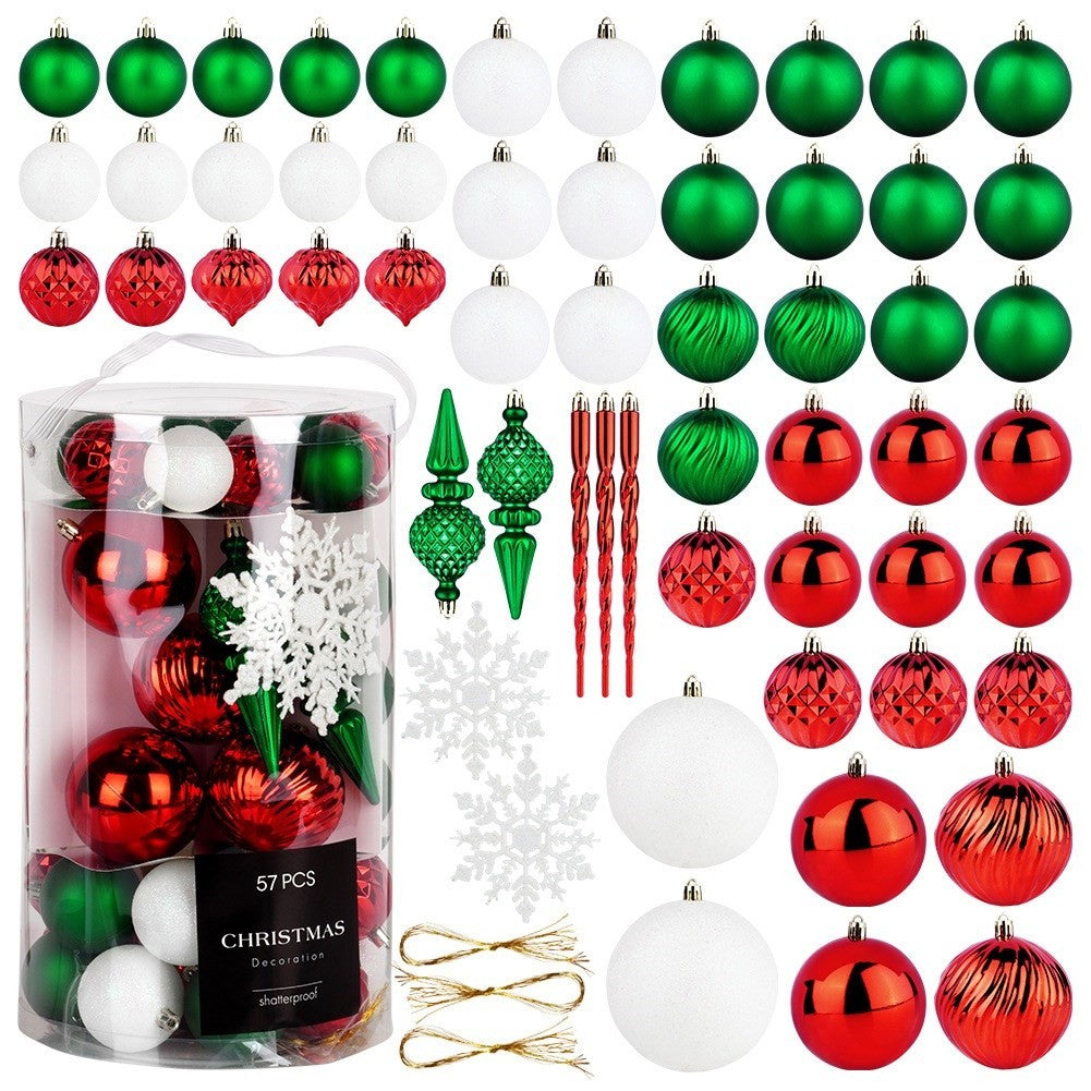 Adornos navideños en rojo, verde, blanco y plateado, incluyendo bolas, carámbanos y copos de nieve. Un recipiente transparente contiene algunos.