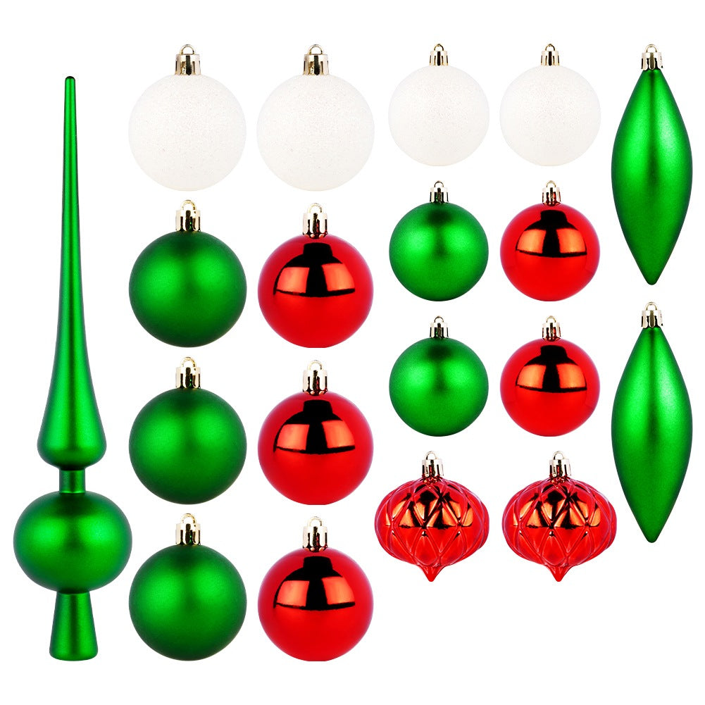 Surtido de adornos navideños: adorno verde para la copa del árbol, bolas blancas, verdes y rojas, y dos adornos verdes en forma de lágrima.