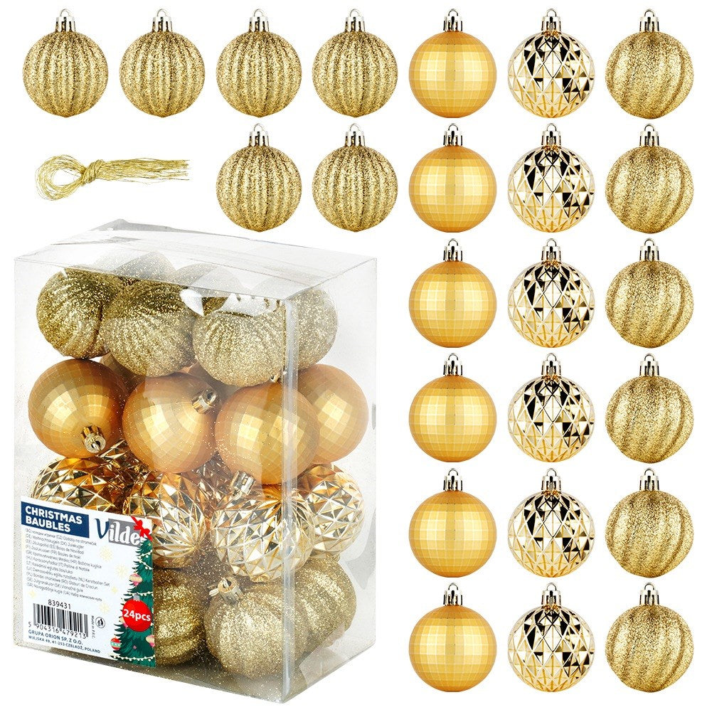 Un juego de bolas doradas de Navidad en una caja transparente, varias texturas incluyendo purpurina y diseños facetados. Algunas bolas están fuera de la caja.