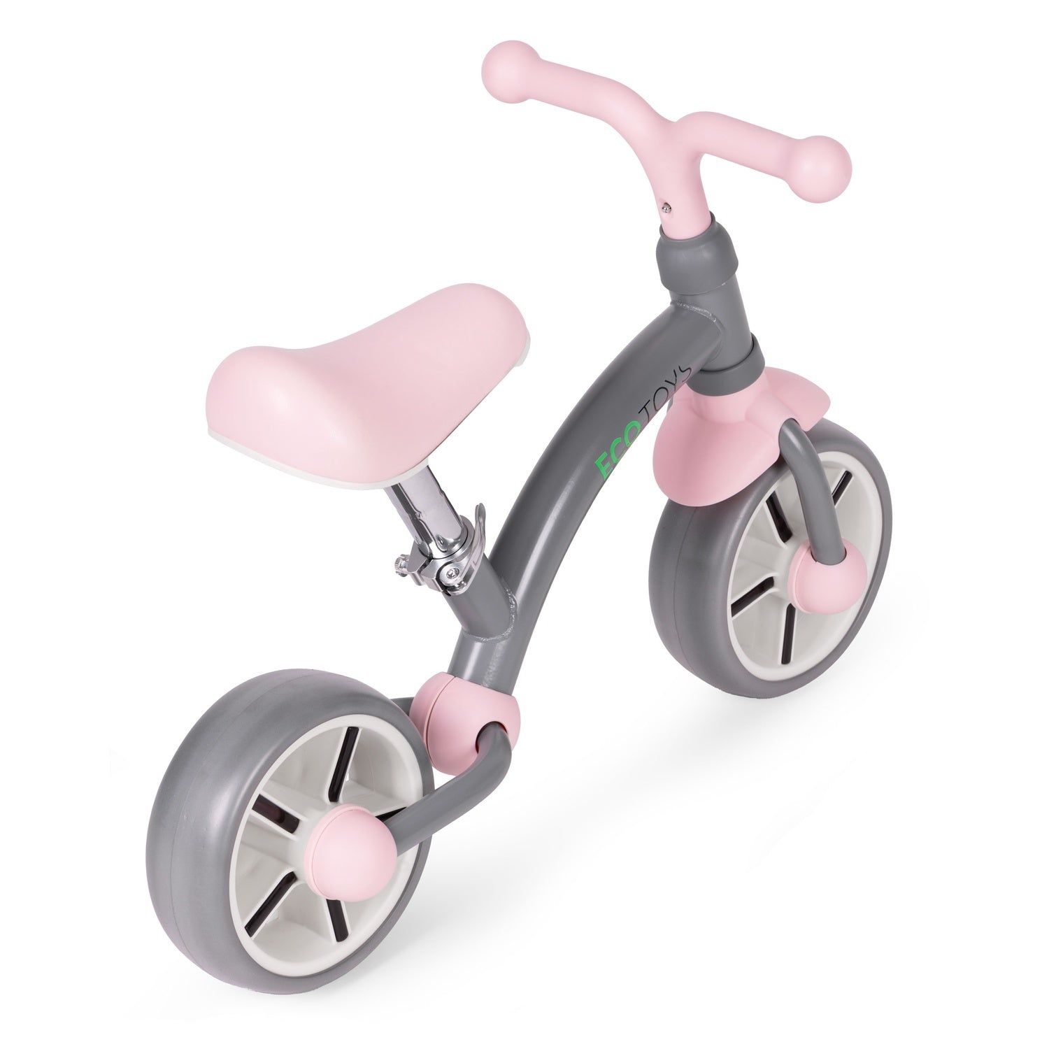 Una bicicleta de equilibrio rosa y gris para niños pequeños. Tiene un asiento, manillar y detalles rosas, con ruedas y cuadro grises.