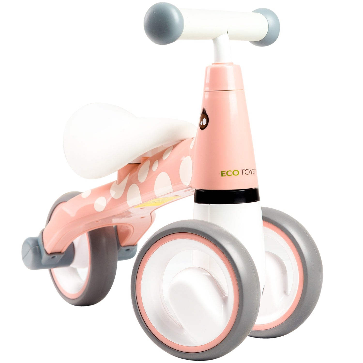 Una bici senza pedali rosa e bianca con pois bianchi, ruote grigie e un sellino bianco. Ha un design a forma di giraffa.