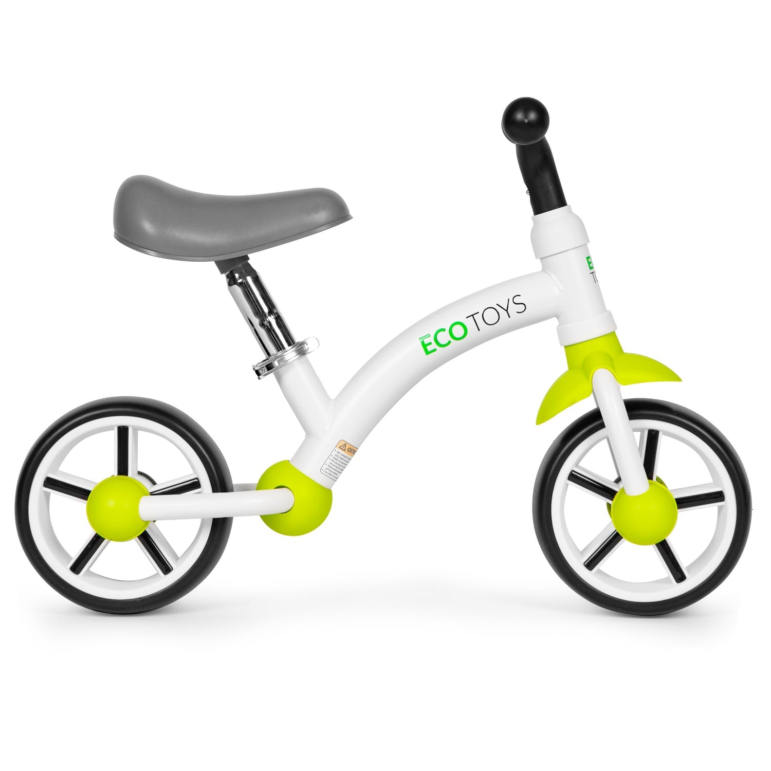 Una bicicleta de equilibrio blanca y verde. Tiene un asiento gris, ruedas negras y blancas y un manillar negro. La marca "ECO TOYS" es visible.