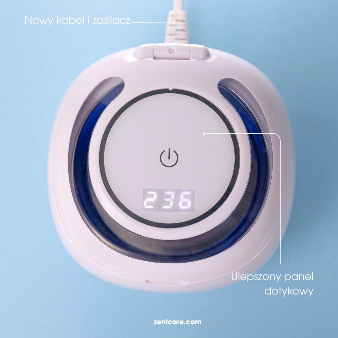 Biało-niebieskie urządzenie z cyfrowym wyświetlaczem 236. Widoczny przycisk zasilania. Kabel podłączony u góry.