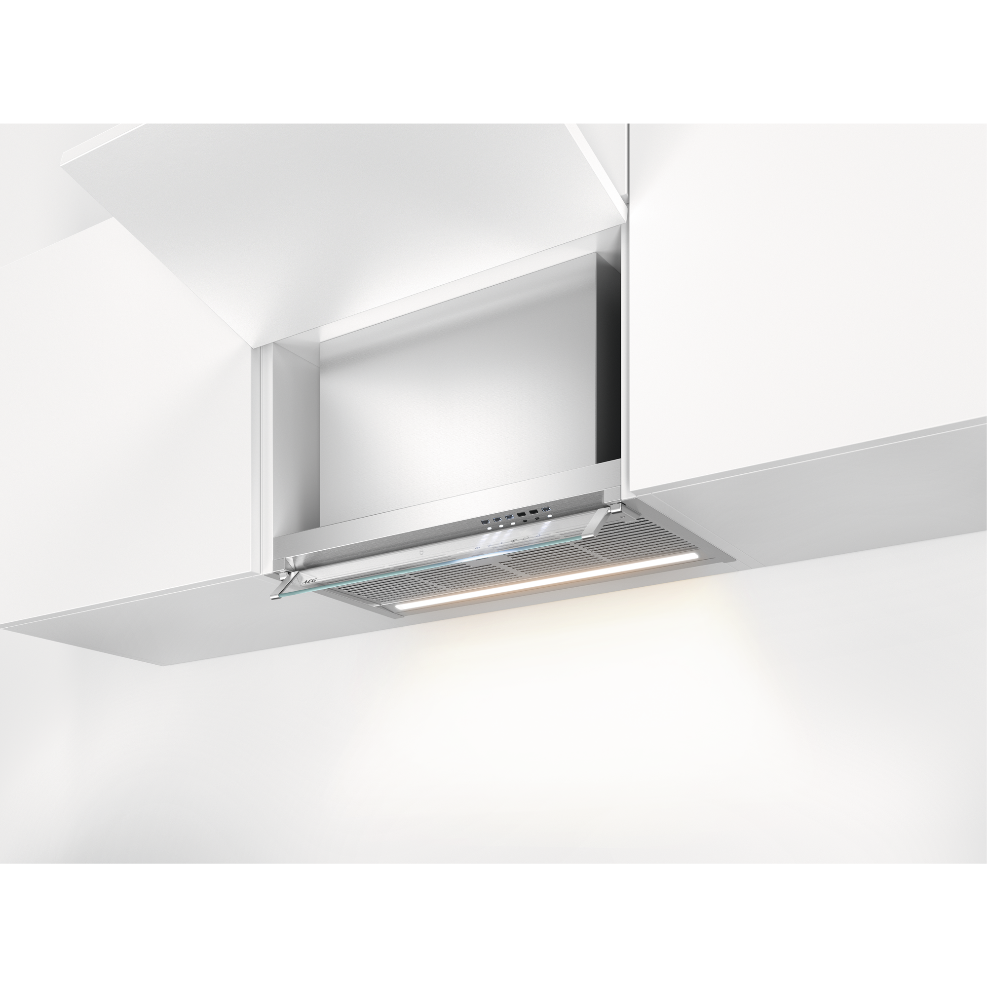 Una moderna campana extractora de cocina está instalada dentro de gabinetes blancos. Tiene un acabado de acero inoxidable y luz.
