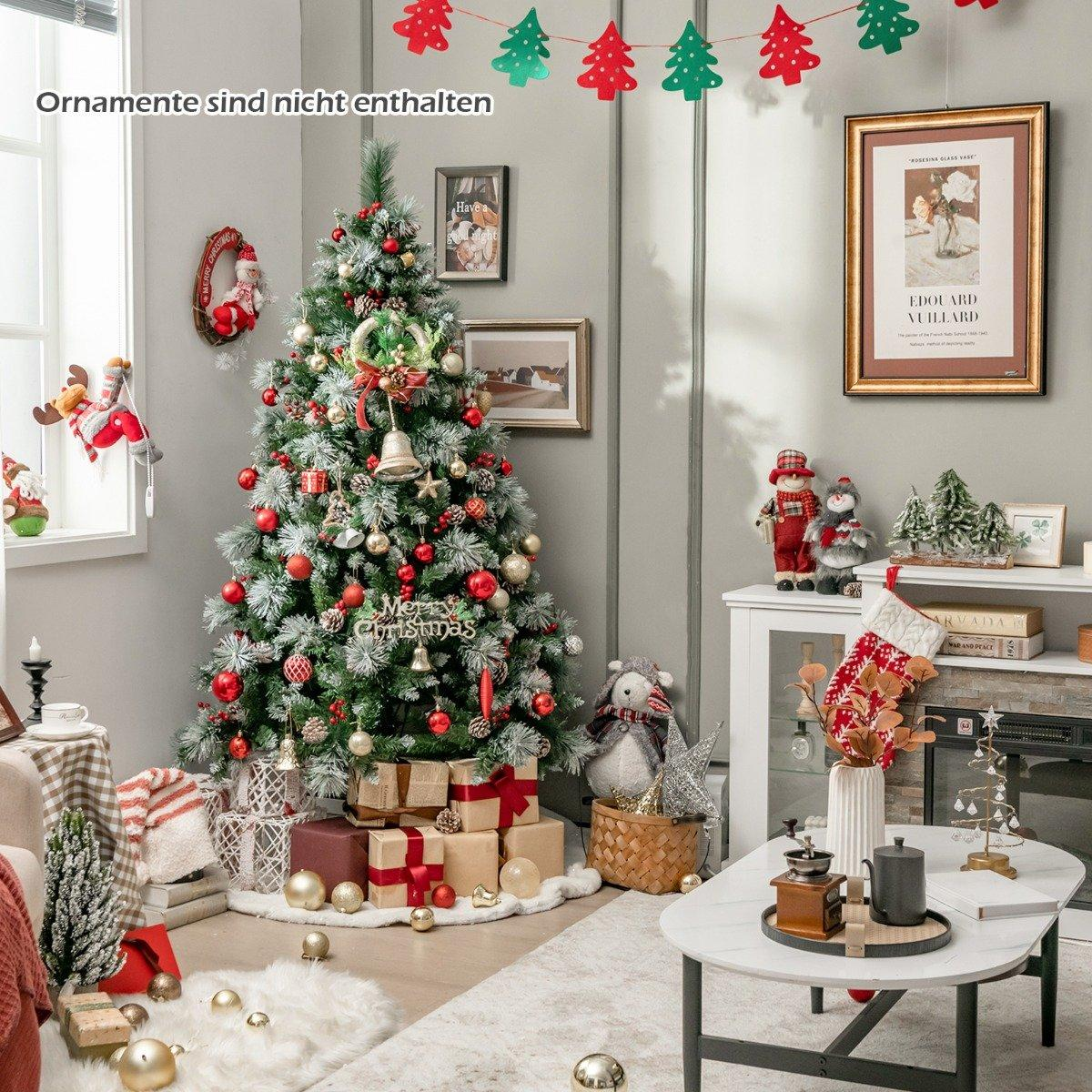 Un árbol de Navidad decorado con adornos rojos y dorados. Debajo hay regalos y una alfombra blanca. Una guirnalda de árboles cuelga arriba.