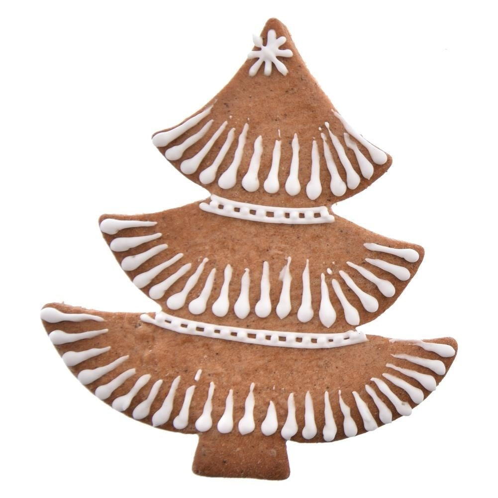 Un árbol de Navidad de jengibre. Galleta marrón con detalles de glaseado blanco. Estrella en la parte superior, líneas blancas en los bordes y un borde blanco.