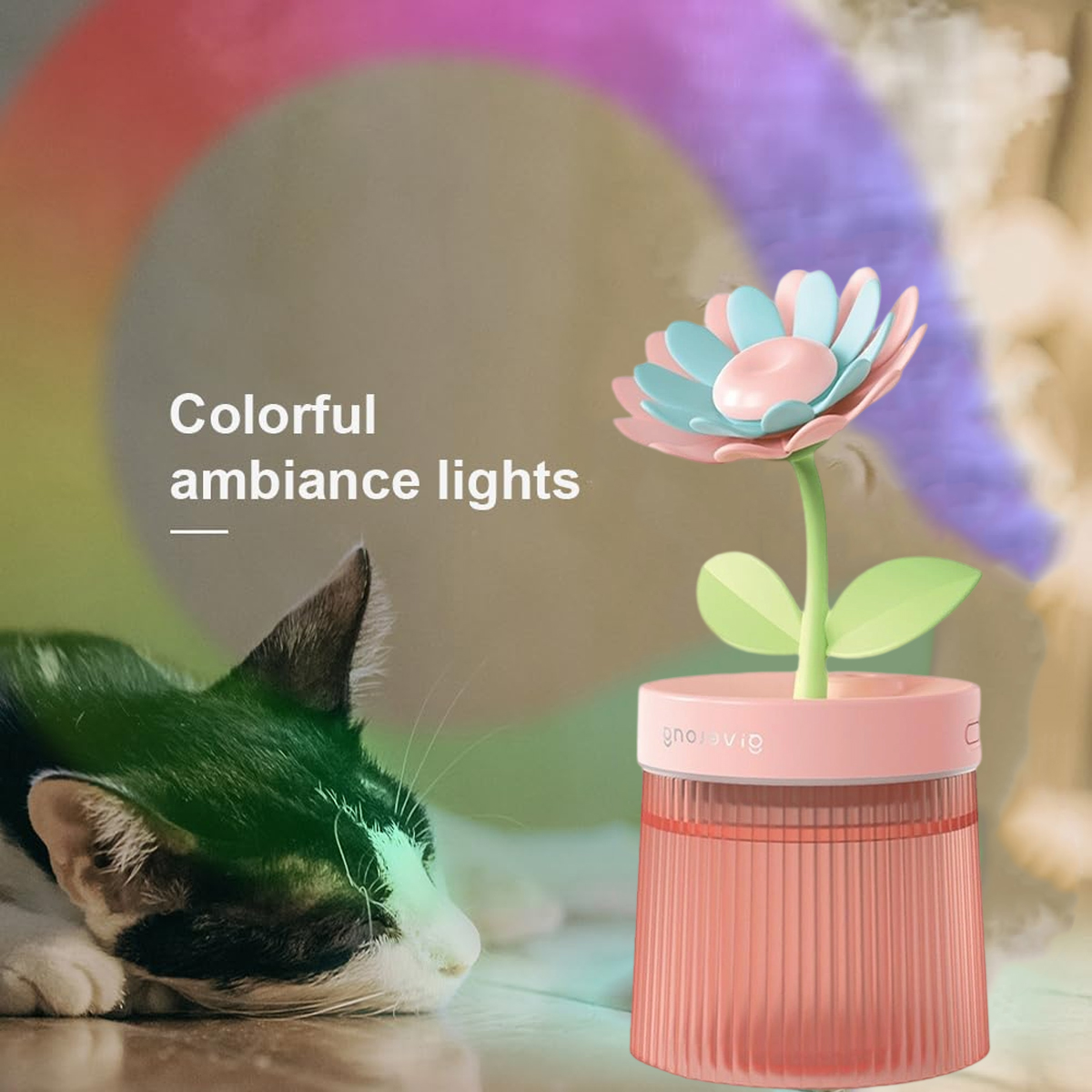 Eine Blumenlampe mit Katze. Die Lampe hat rosa, blau und grüne Farben. Ein Regenbogen von Farben ist im Hintergrund.