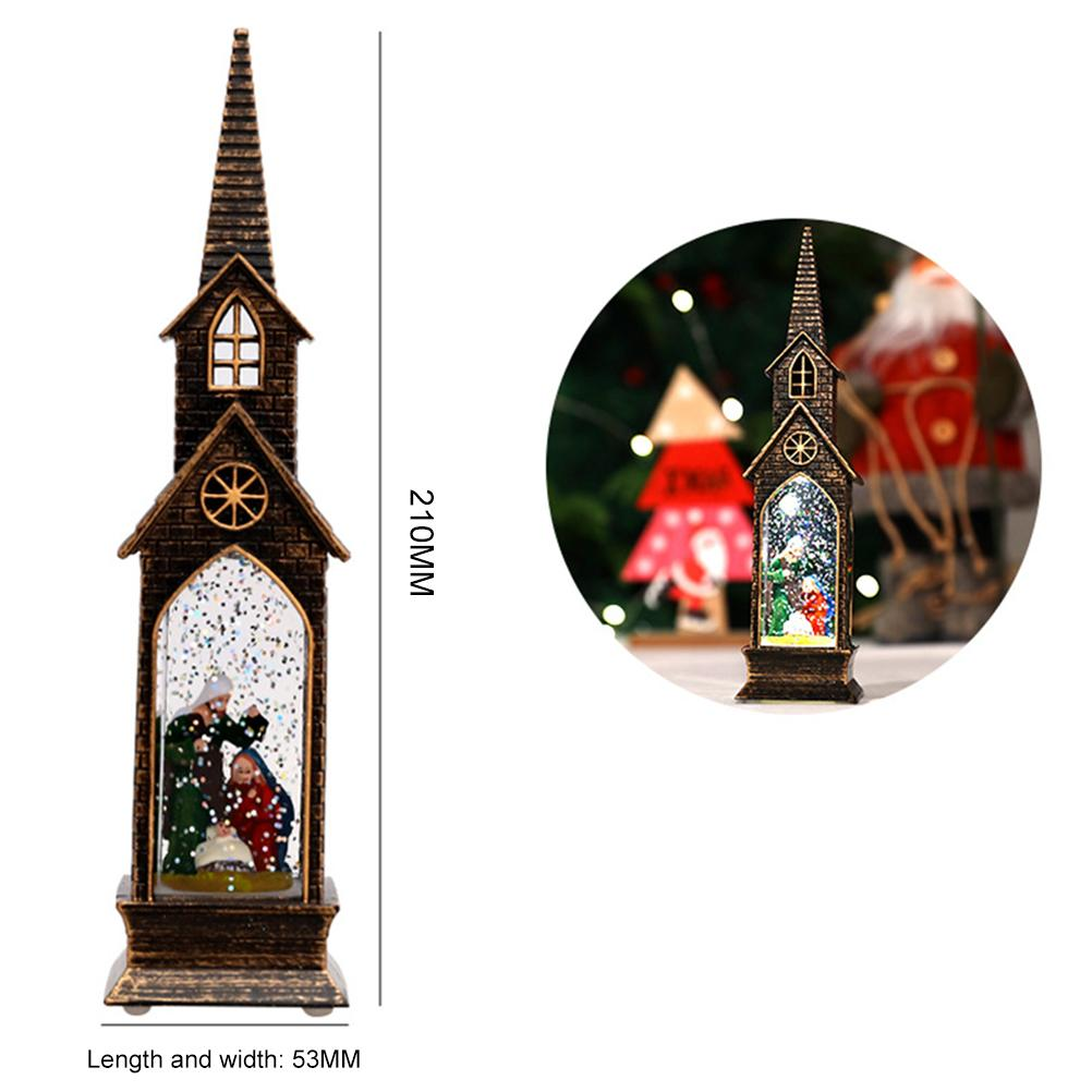 Eine Weihnachts-Schneekugel in Form einer Kirche. Sie zeigt eine Krippenszene im Inneren, mit braunem Äußeren und spitzem Dach.