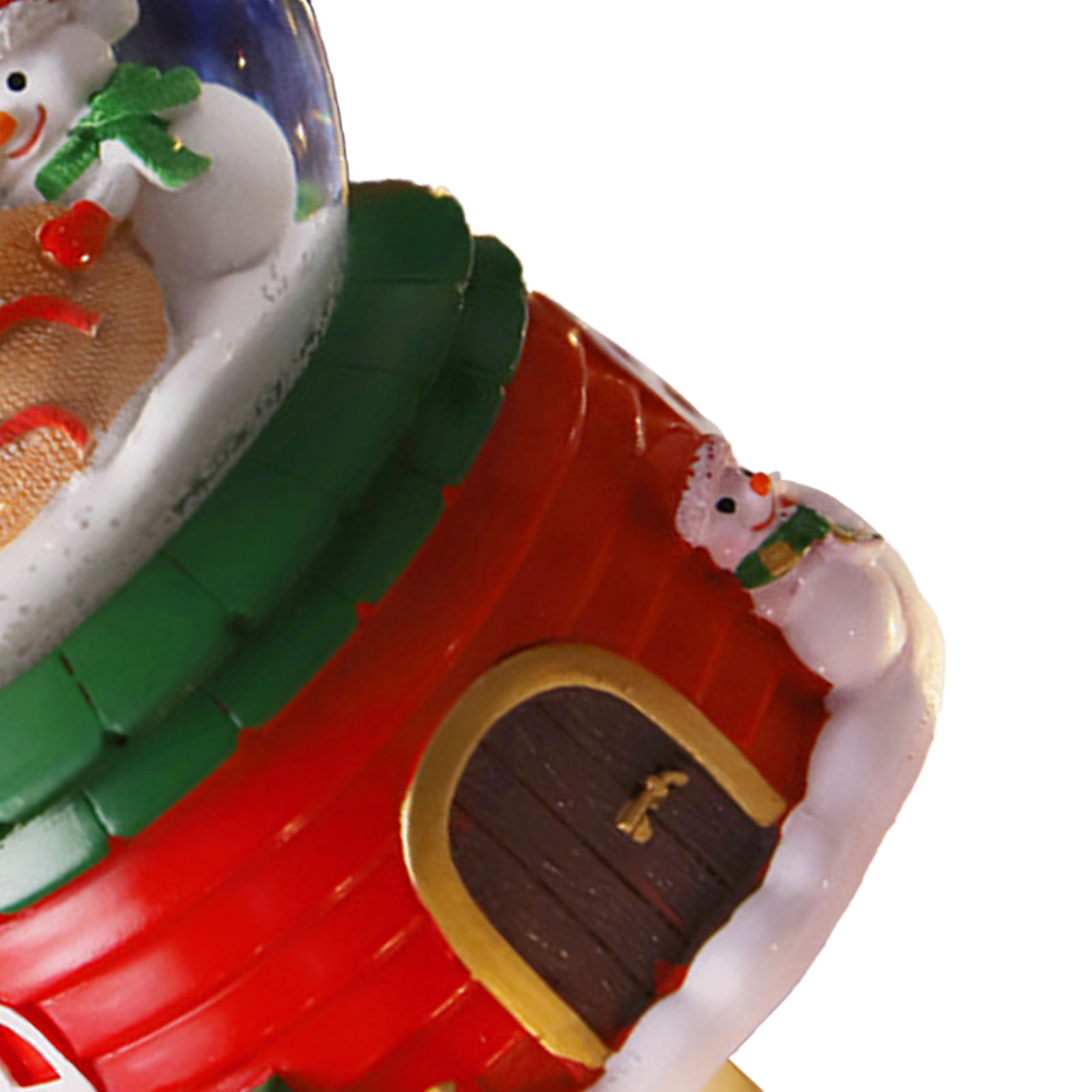 Ein Weihnachtsschmuck mit einem Schneemann, rotem Dach, grünem Dach und einer Tür.
