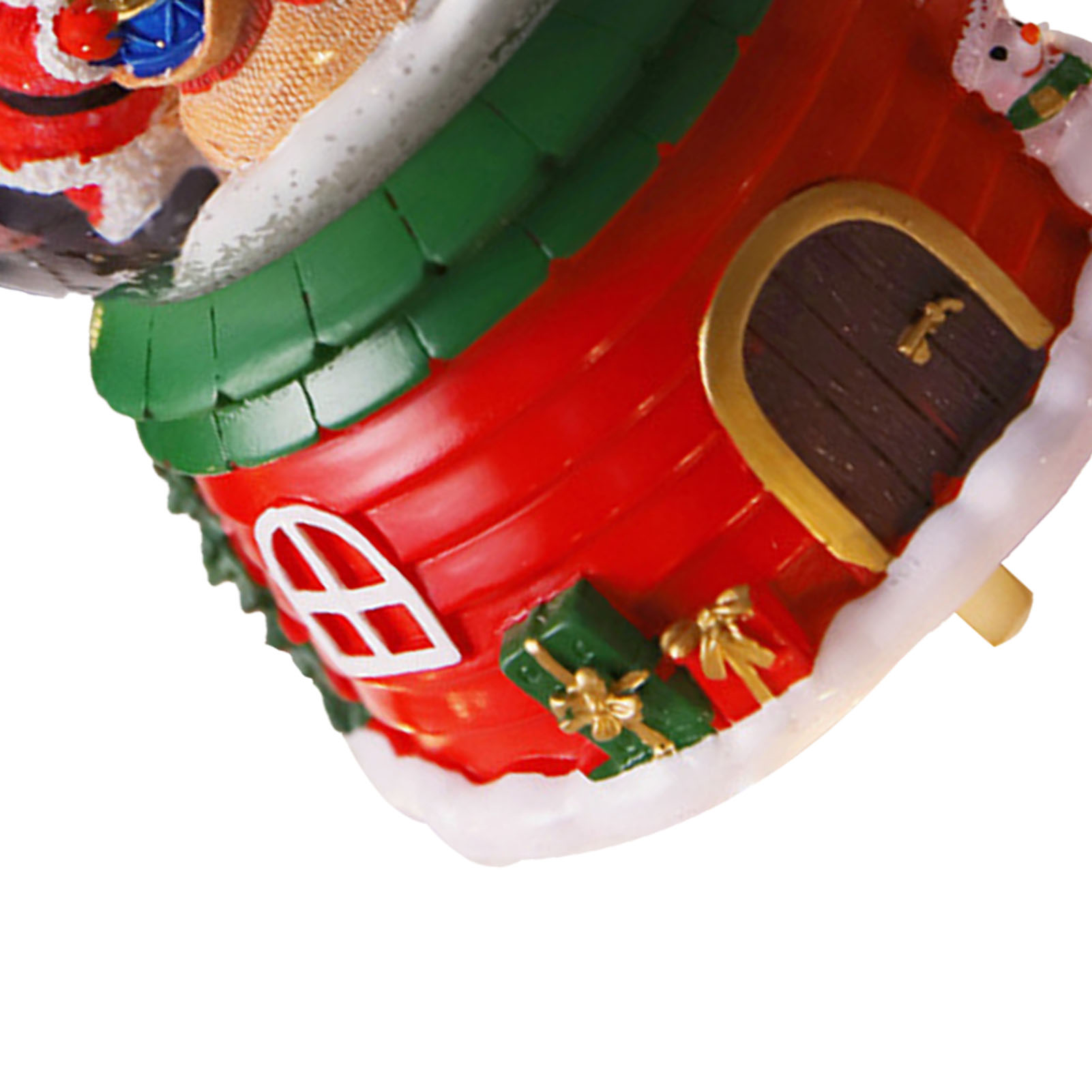 Ein weihnachtliches Ornament, hausförmig, rotes Dach, grüne Verzierungen, weißer Schnee, Tür und Geschenke. Weihnachtsmann oben.