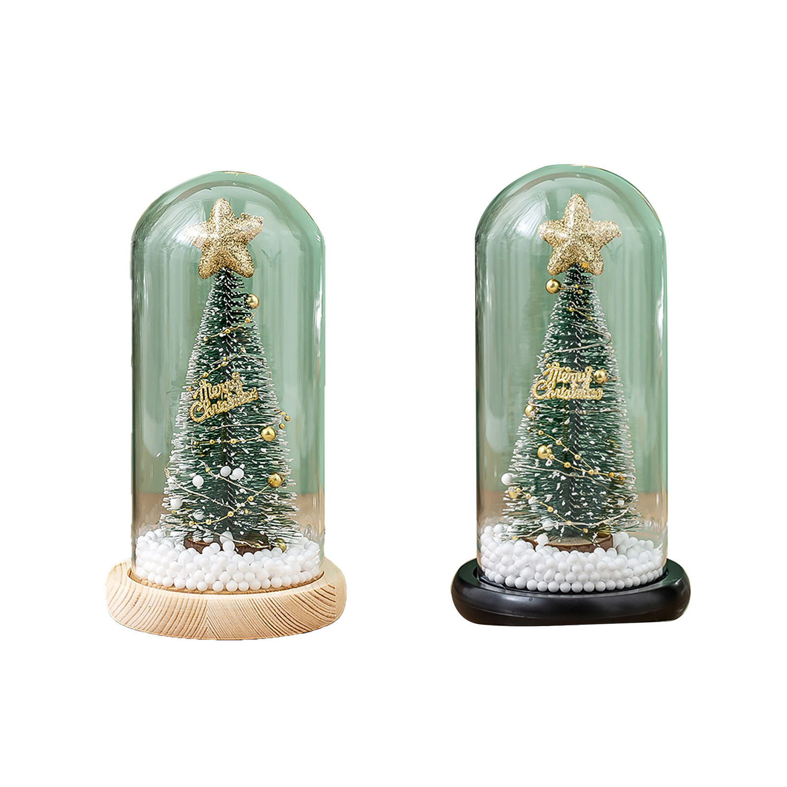Zwei Weihnachtsbäume in Glaskuppeln, je mit Stern. Einer auf Holz, der andere auf Schwarz.