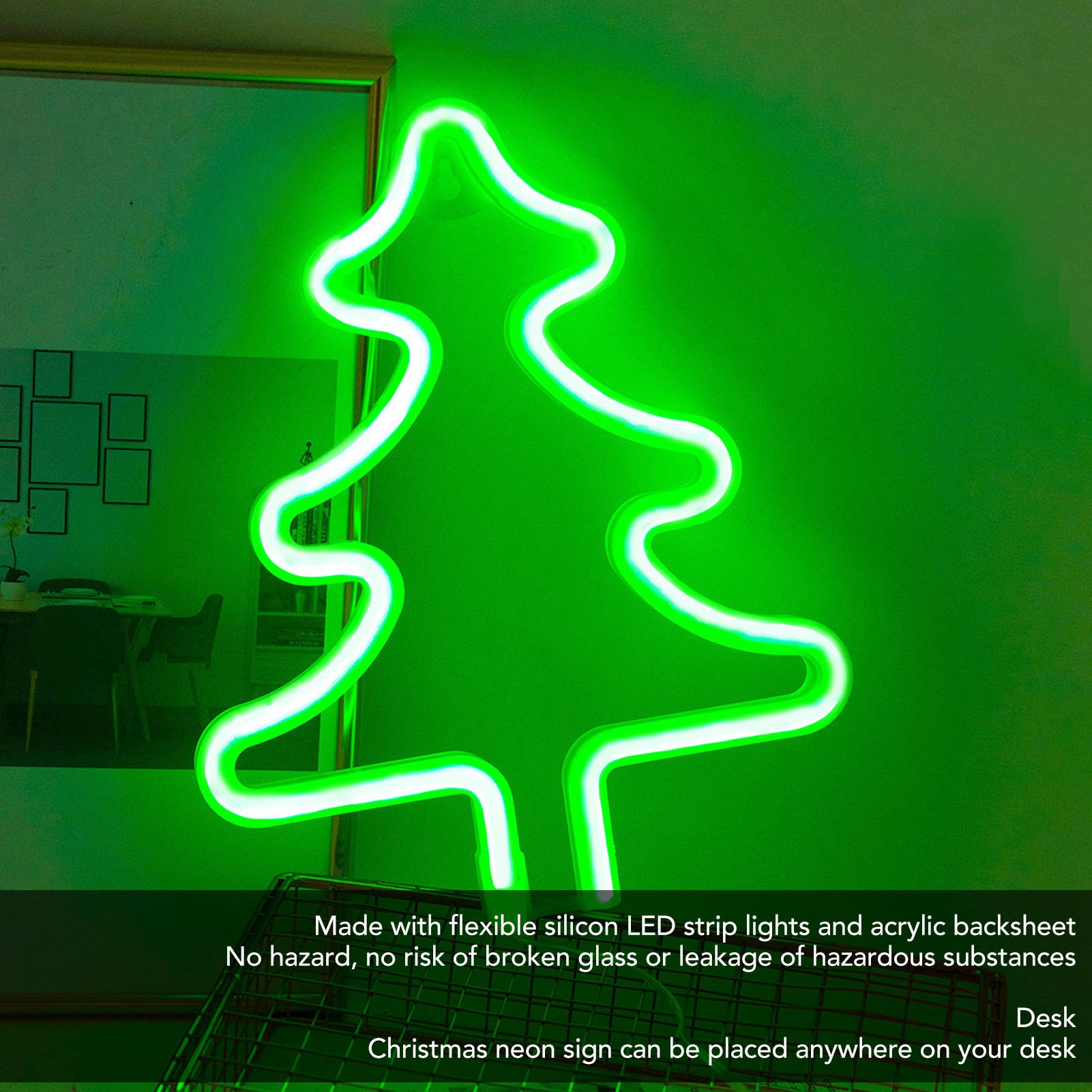 Ein grünes Neon-Weihnachtsbaumschild an einer grünen Wand. Es hat weiße Umrisse und ist beleuchtet. Der Hintergrund hat einen gerahmten Spiegel.