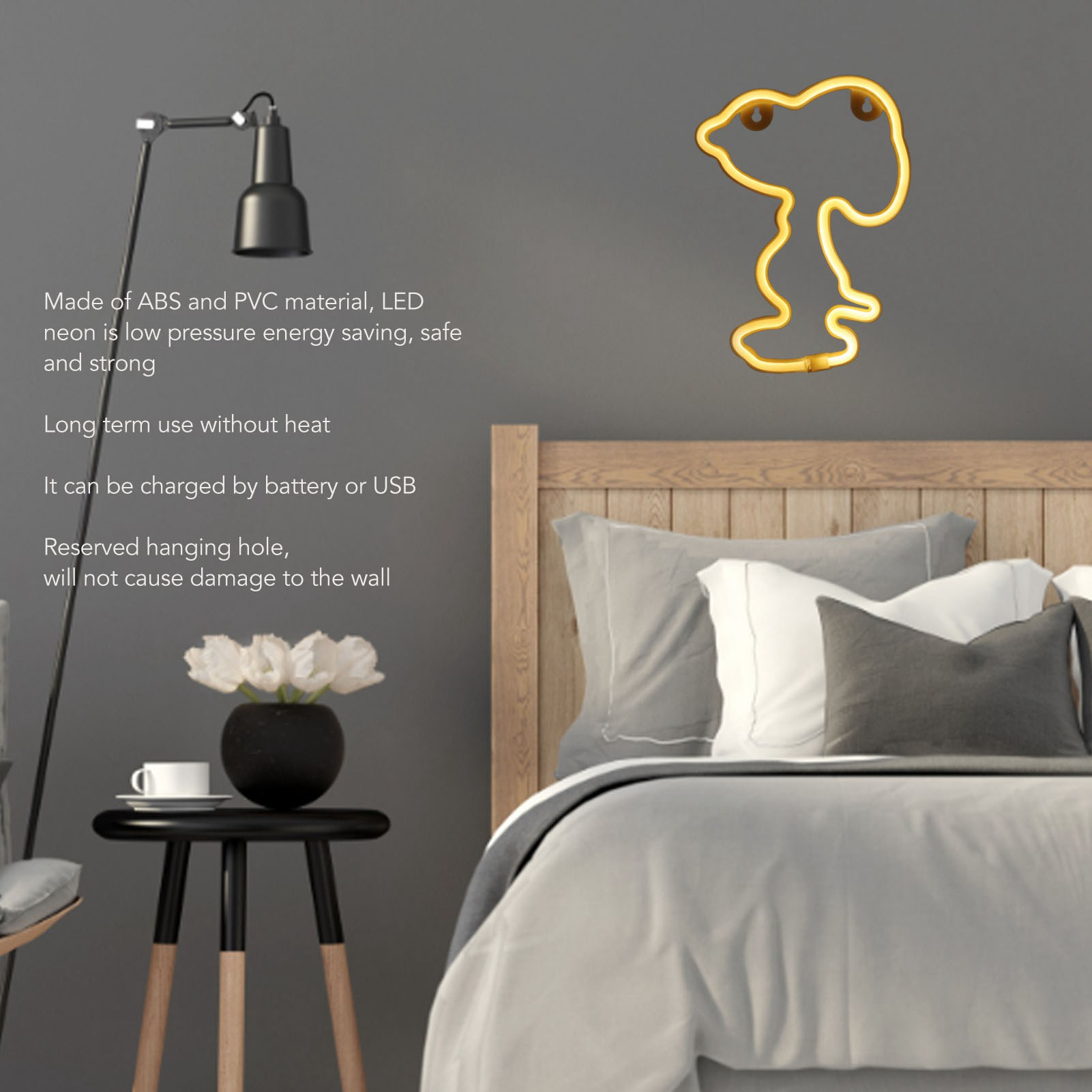 Ein Schlafzimmer mit Snoopy-Neonlicht, Tisch mit Blumen und Bett mit Kissen und Bettdecke.