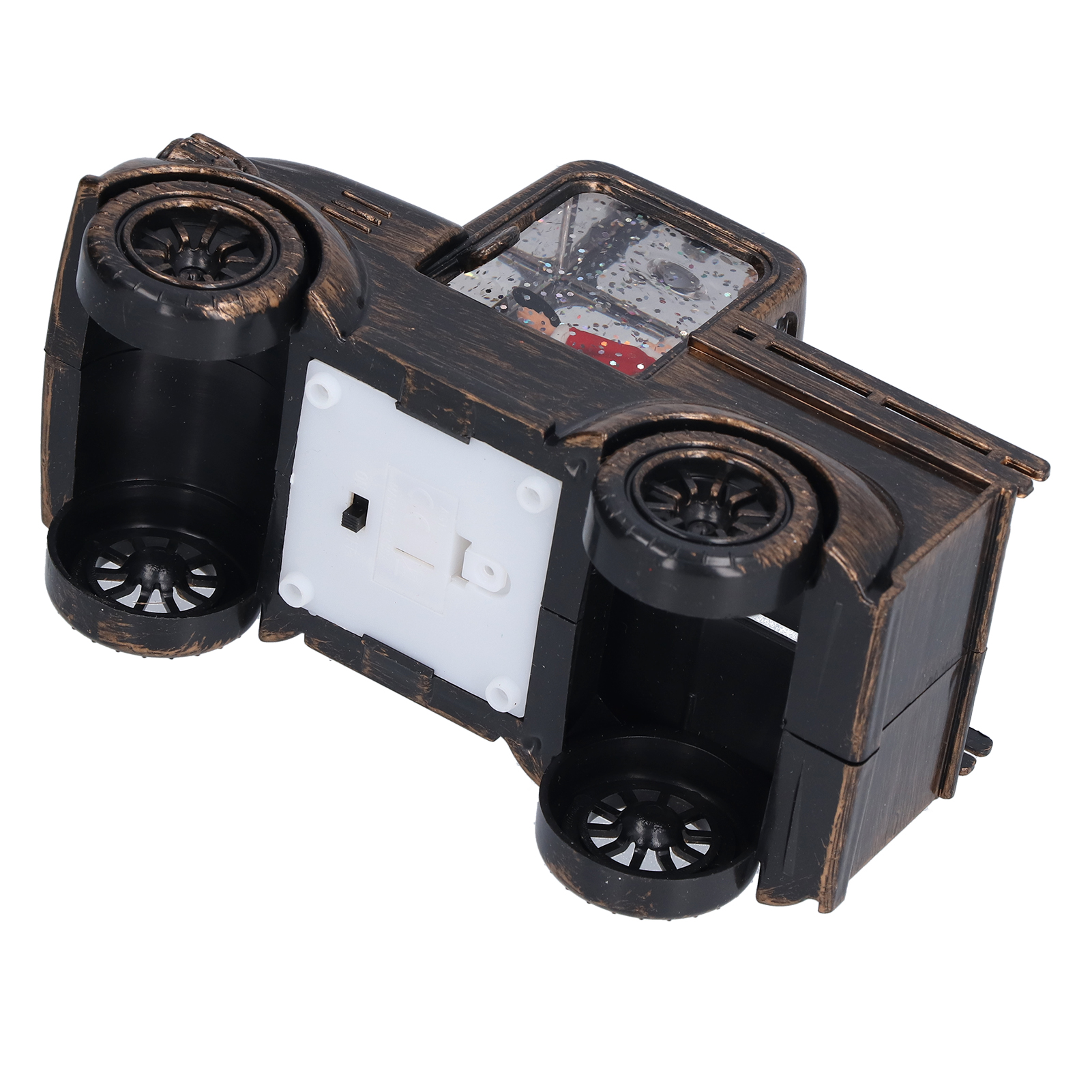 Ein bronzefarbenes Spielzeugauto ist von unten zu sehen. Das Auto hat Räder und einen transparenten Bereich mit Glitzer und einer kleinen Szene.