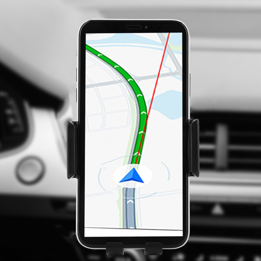 Smartphone in einer Autohalterung zeigt eine Navigationskarte. Grüne Route, blaue Markierung und rote Linie sichtbar. Autoinnenraum unscharf im Hintergrund.