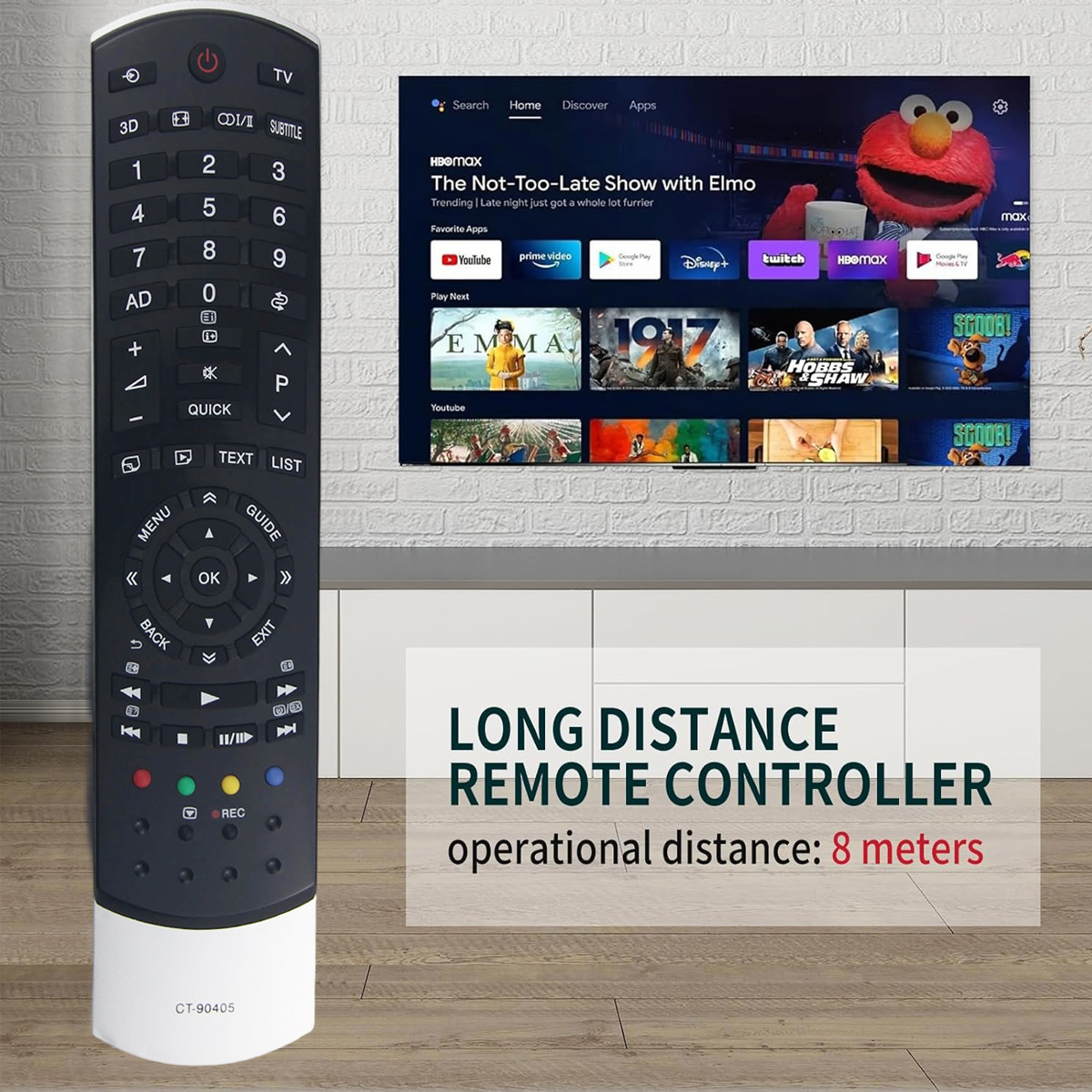 Eine Fernbedienung befindet sich im Vordergrund. Dahinter ist ein Fernsehbildschirm, der Elmo zeigt. Der Text lautet 'Long Distance Remote Controller'.