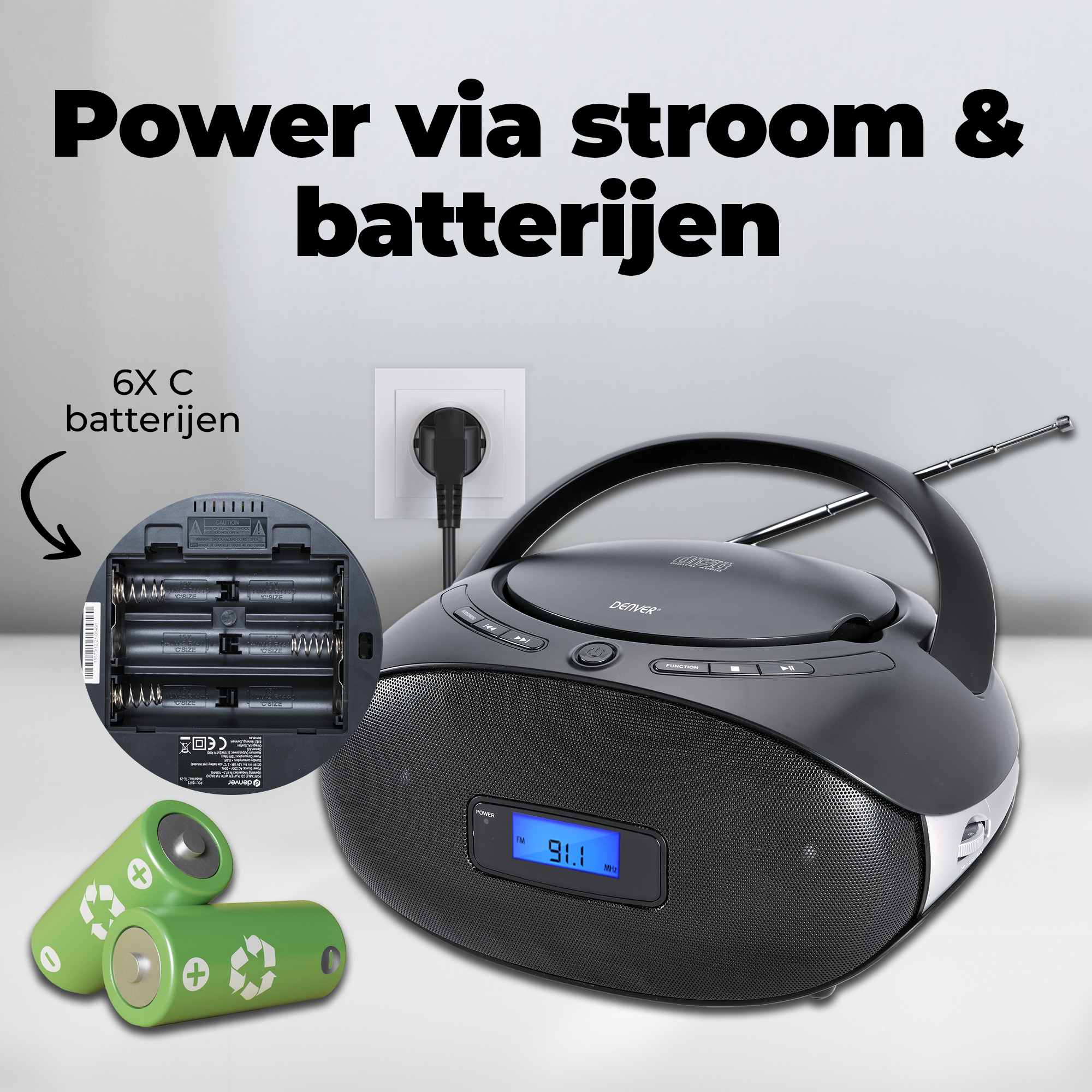 Black Denver radio player. Shows battery compartment, two green batteries, and a plug. Text says 'Power via stroom & batterijen'.