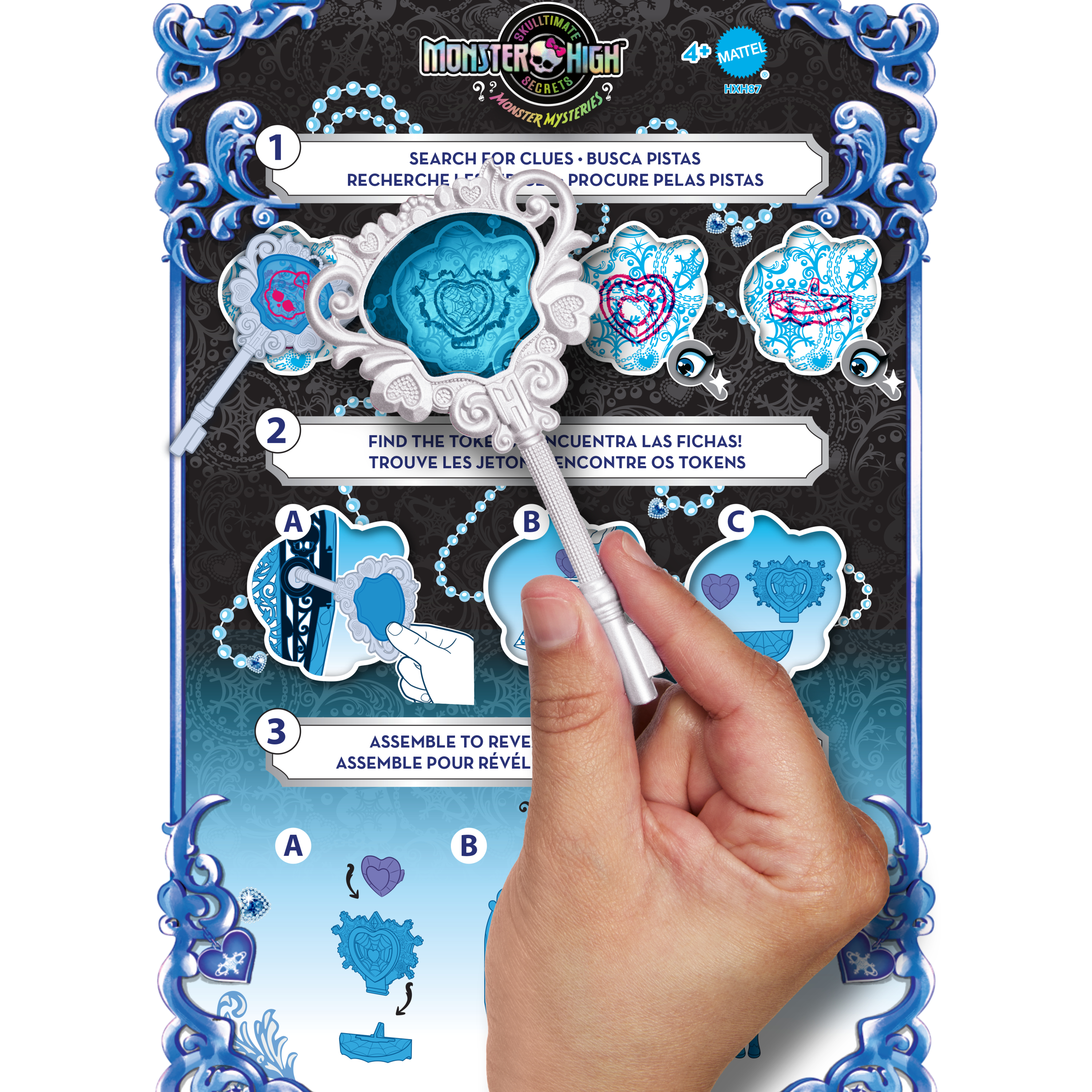 Dłoń trzyma srebrny klucz. Tło przedstawia grę z motywem Monster High ze wskazówkami i żetonami.