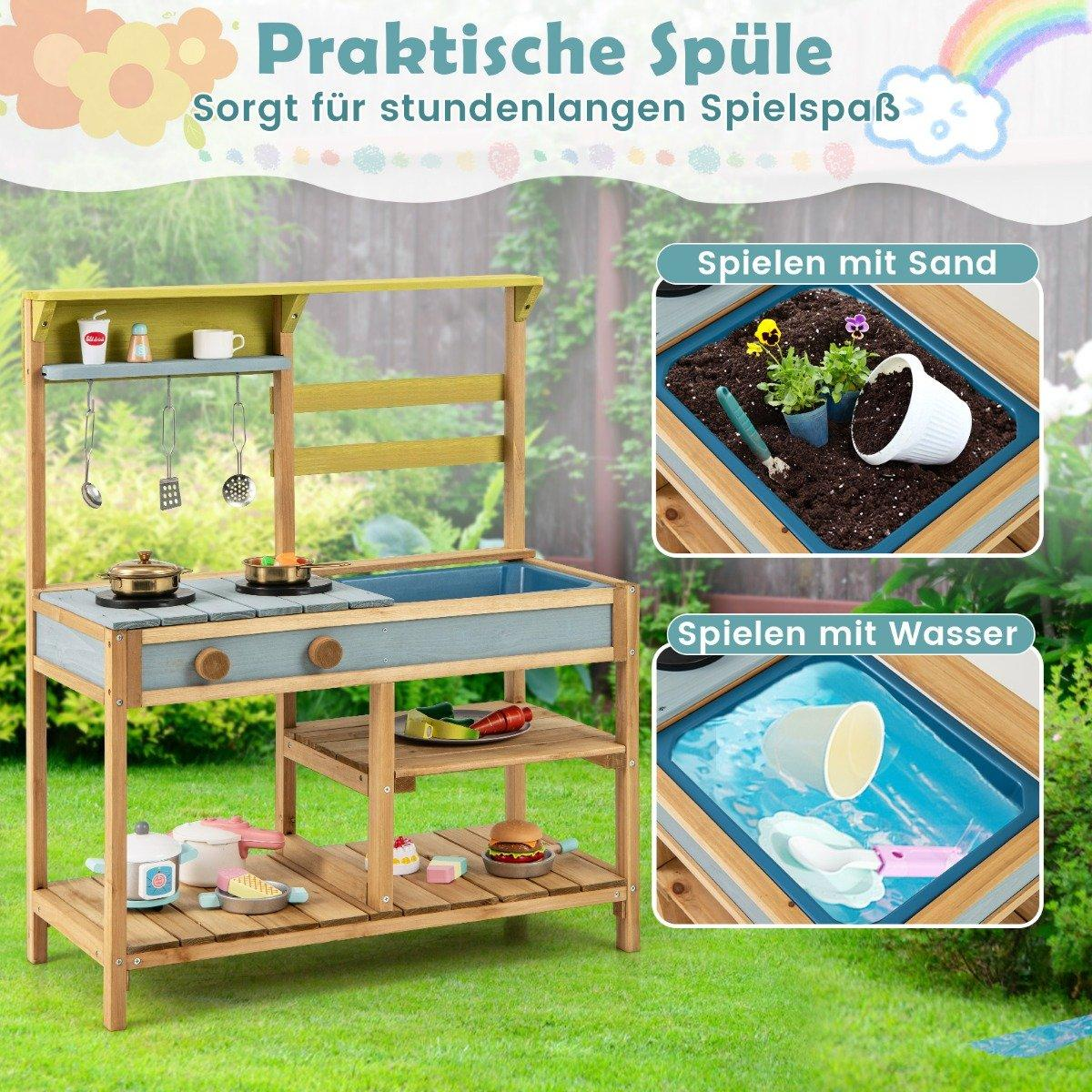 Cocina de madera para niños con áreas de juego para arena y agua. Tiene un fregadero, estufa y estantes con comida y utensilios.