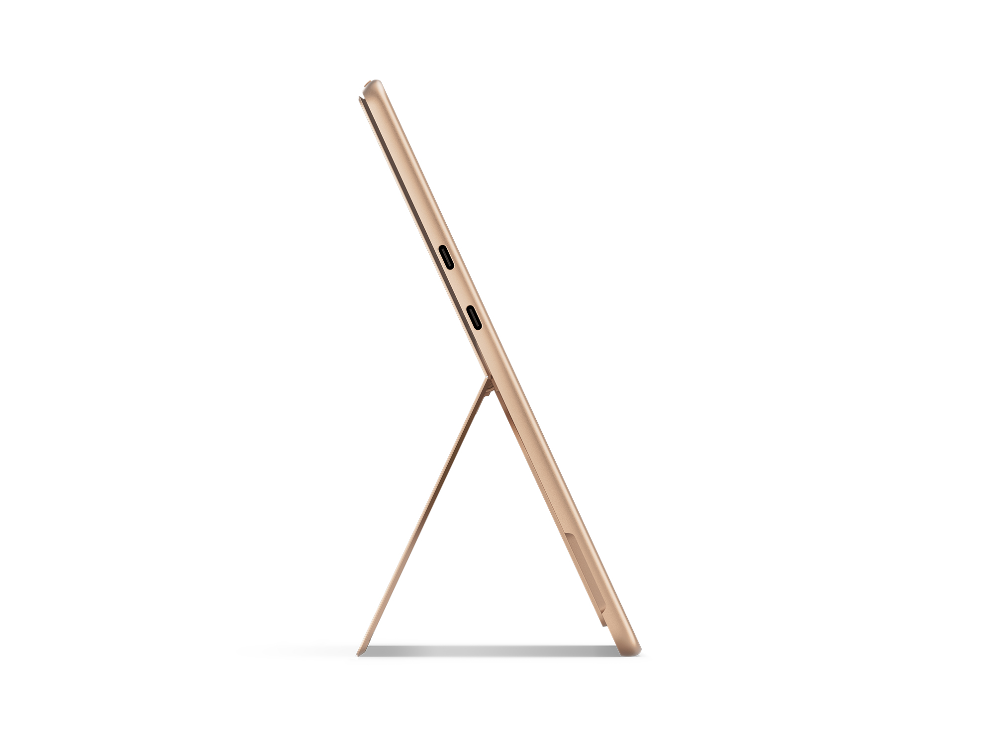 Un tablet dorato è sostenuto da un supporto. Il lato con due porte è visibile. Lo sfondo è bianco semplice.