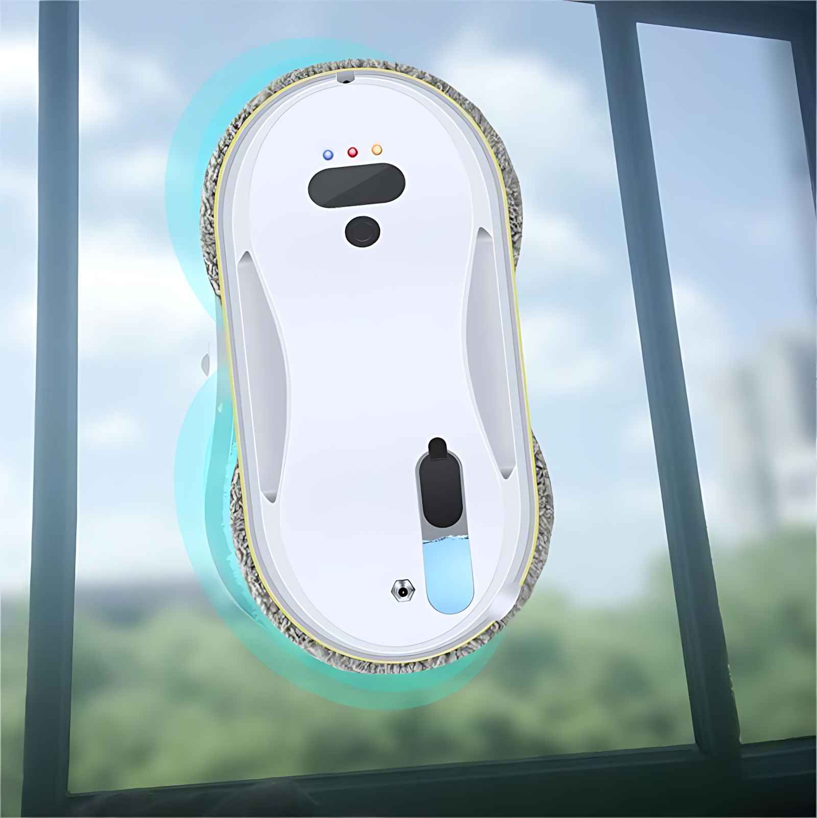 Ein weißer Fensterputzroboter auf einer Glasscheibe. Er hat ein blaues Reinigungspad und putzt das Glas. Der Hintergrund ist unscharf.
