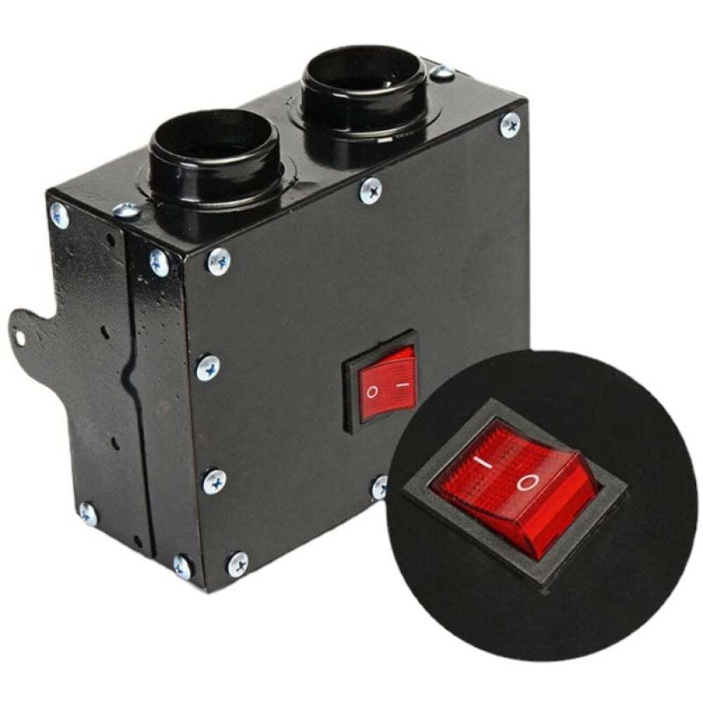 Eine schwarze Box mit zwei kreisförmigen Öffnungen, einem roten Schalter und einem kreisförmigen Einsatz mit einem größeren roten Schalter. Schrauben sind sichtbar.