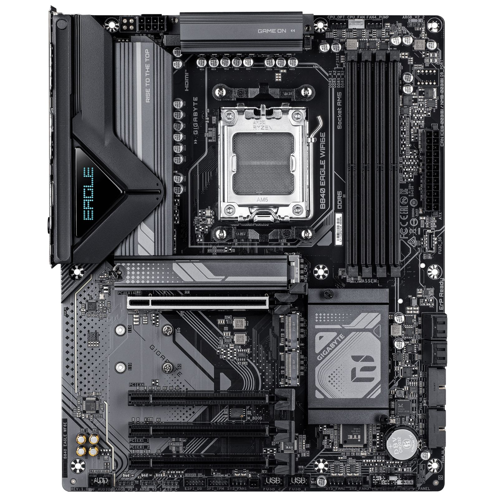 Une carte mère d'ordinateur avec divers composants, dont un socket CPU, des emplacements RAM et le logo Gigabyte, en noir et gris.