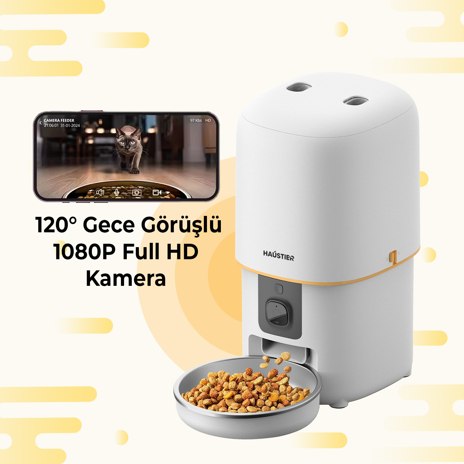 Dahili kameraya sahip beyaz bir kedi maması dağıtıcısı. Telefon ekranında bir kedi görülüyor. Mama bir kaseye dağıtılıyor.