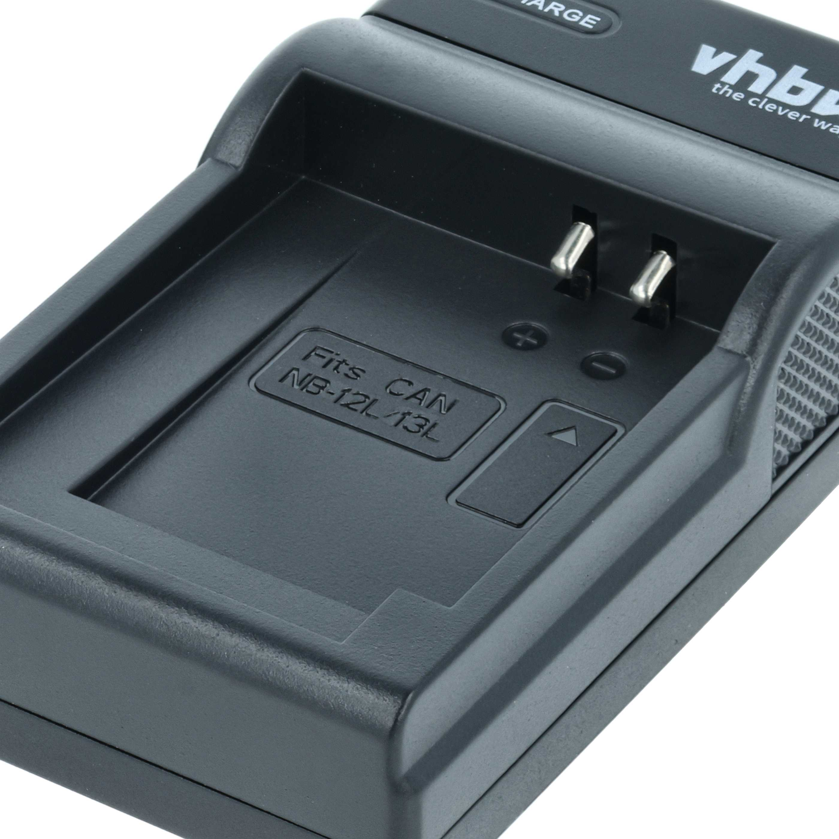 Schwarzes Batterieladegerät mit zwei Metallstiften. Es trägt den Text 'Fits CAN NB-12L/13L' und den Markennamen 'vhb'.