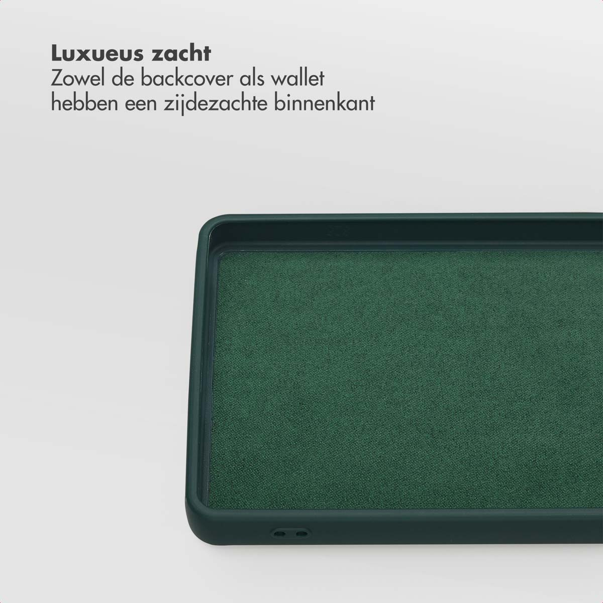 Close-up van een donkergroene telefoonhoes met een gestructureerd interieur. De hoes ligt op een wit oppervlak met Nederlandse tekst.