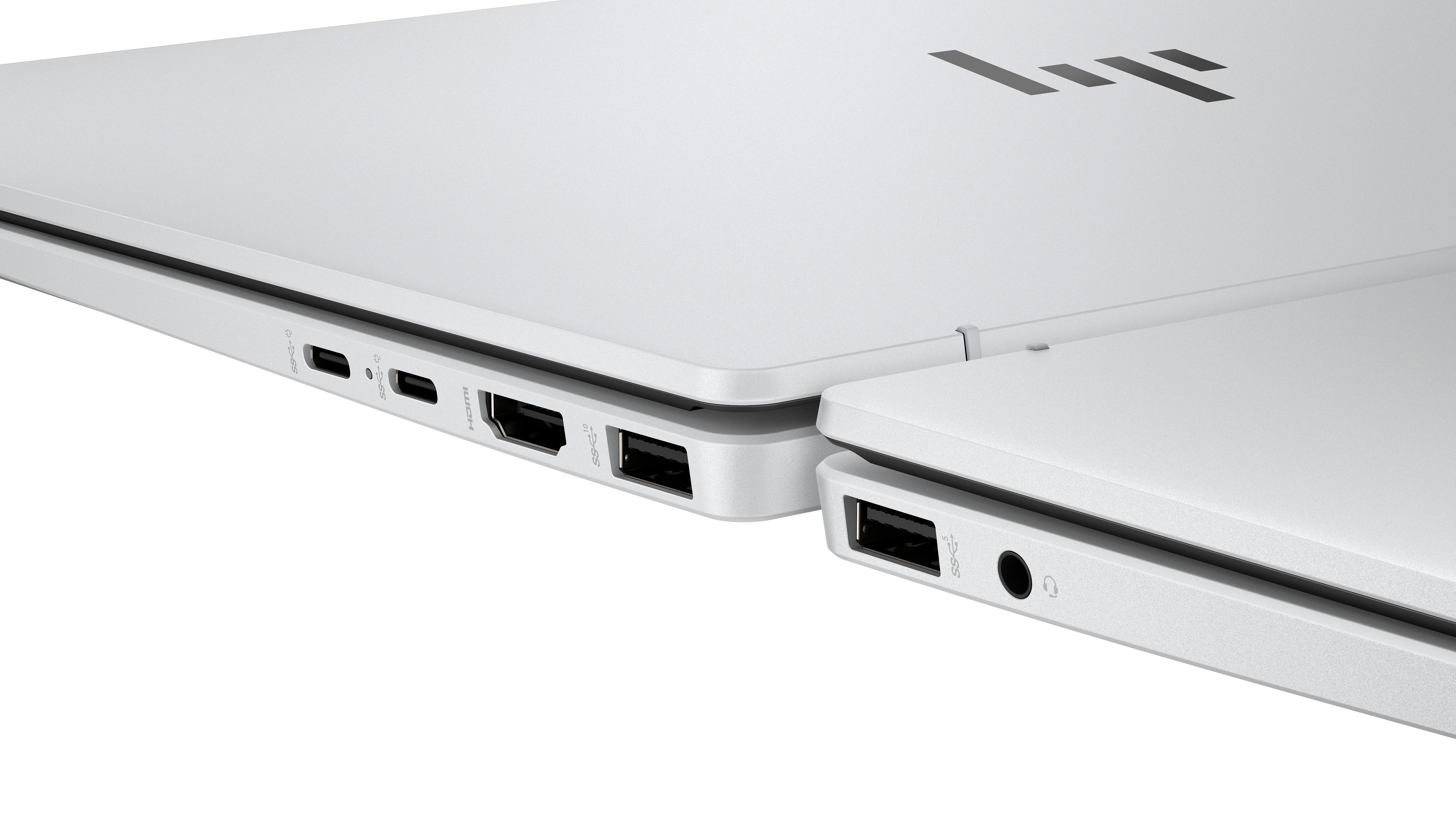 Close-up of a white laptop. Visible ports include USB, HDMI, and audio jack. HP logo is on the top right corner.