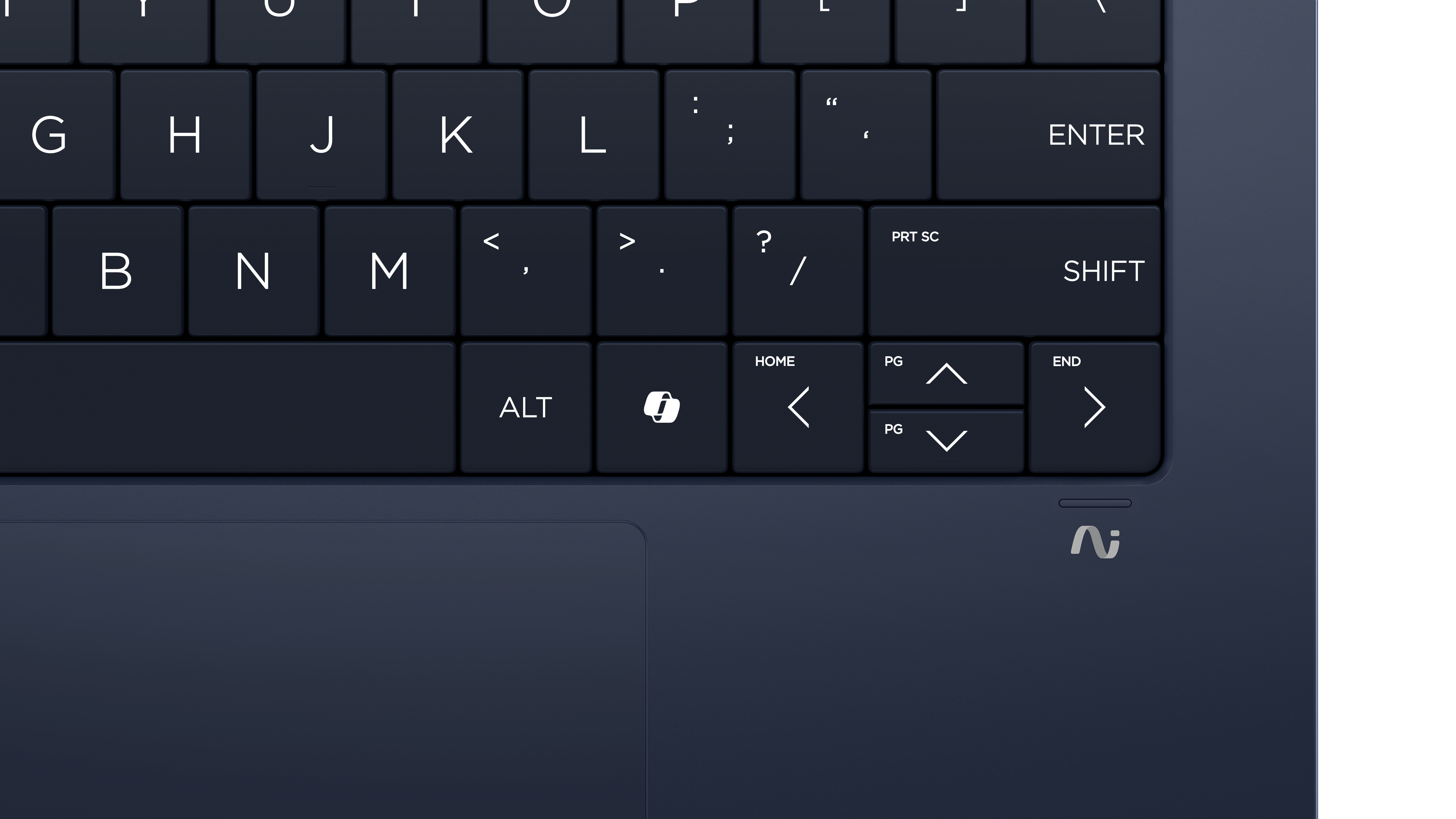 Close-up of a dark blue laptop keyboard. Keys with letters, symbols, and function keys are visible, along with a touchpad.
