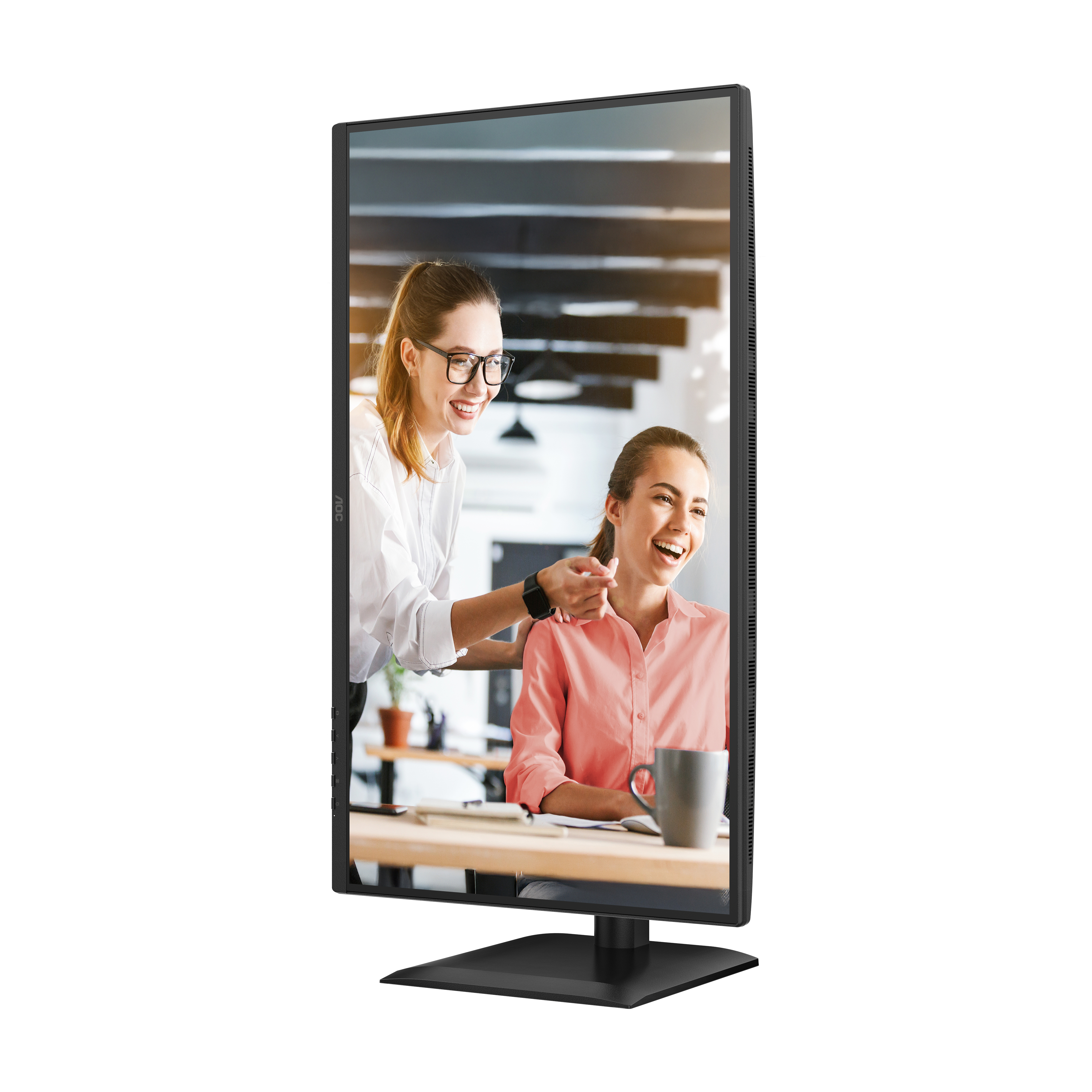 Two women laughing, one touching the other's shoulder. They are in an office, seen through a computer monitor.